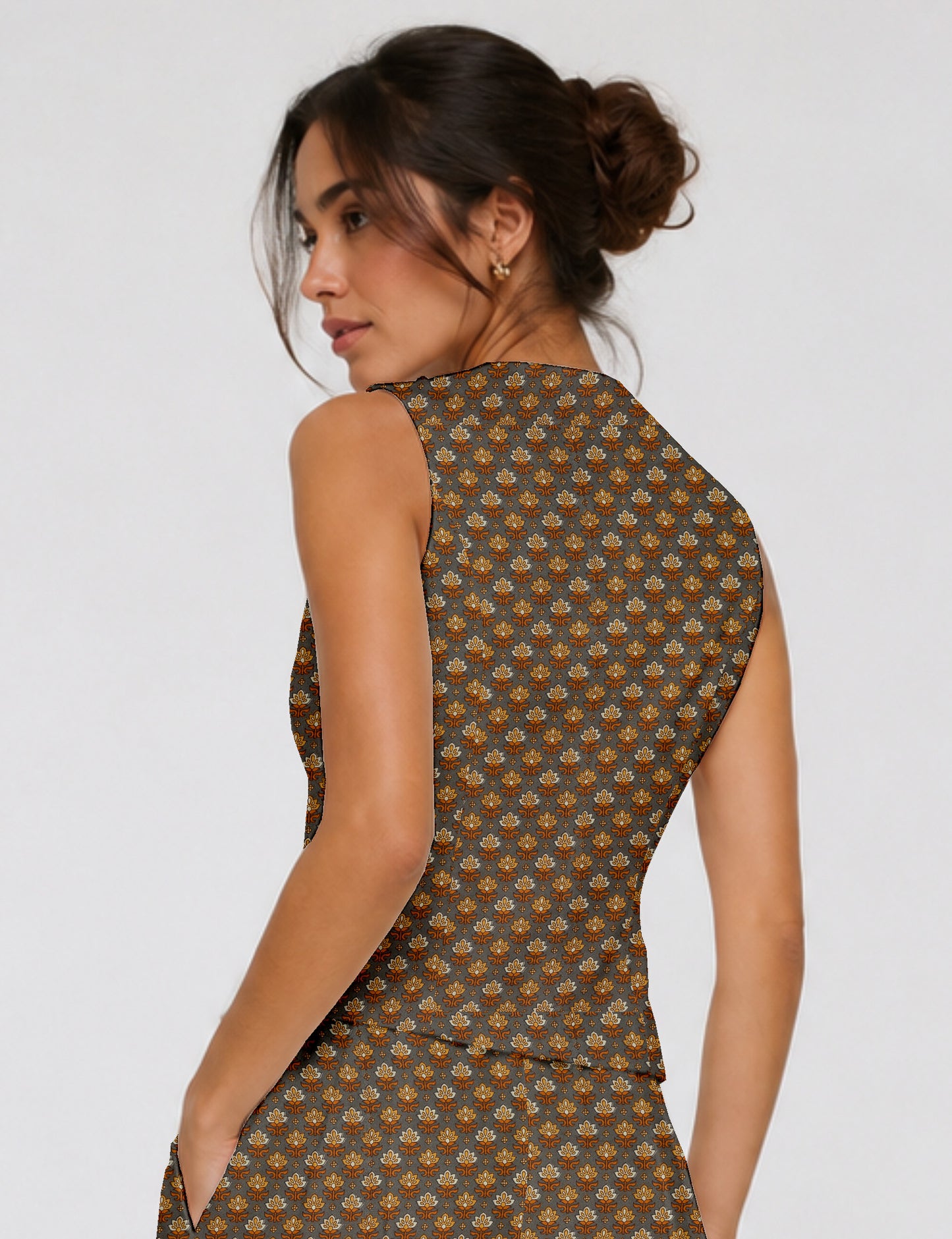 Women's fitted waistcoat with V-neck, single-breasted button closure, tailored silhouette, and pointed hem in sustainable fashion.