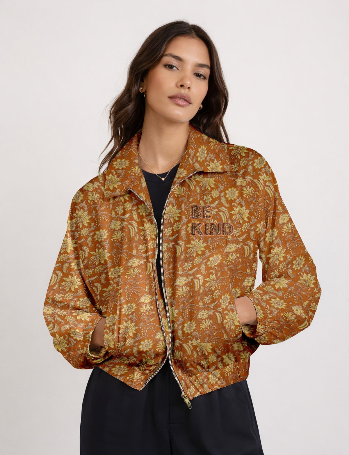 BE KIND Bomber jacket made from upcycled sari fabric with handcrafted Aari embroidery by female artisans.