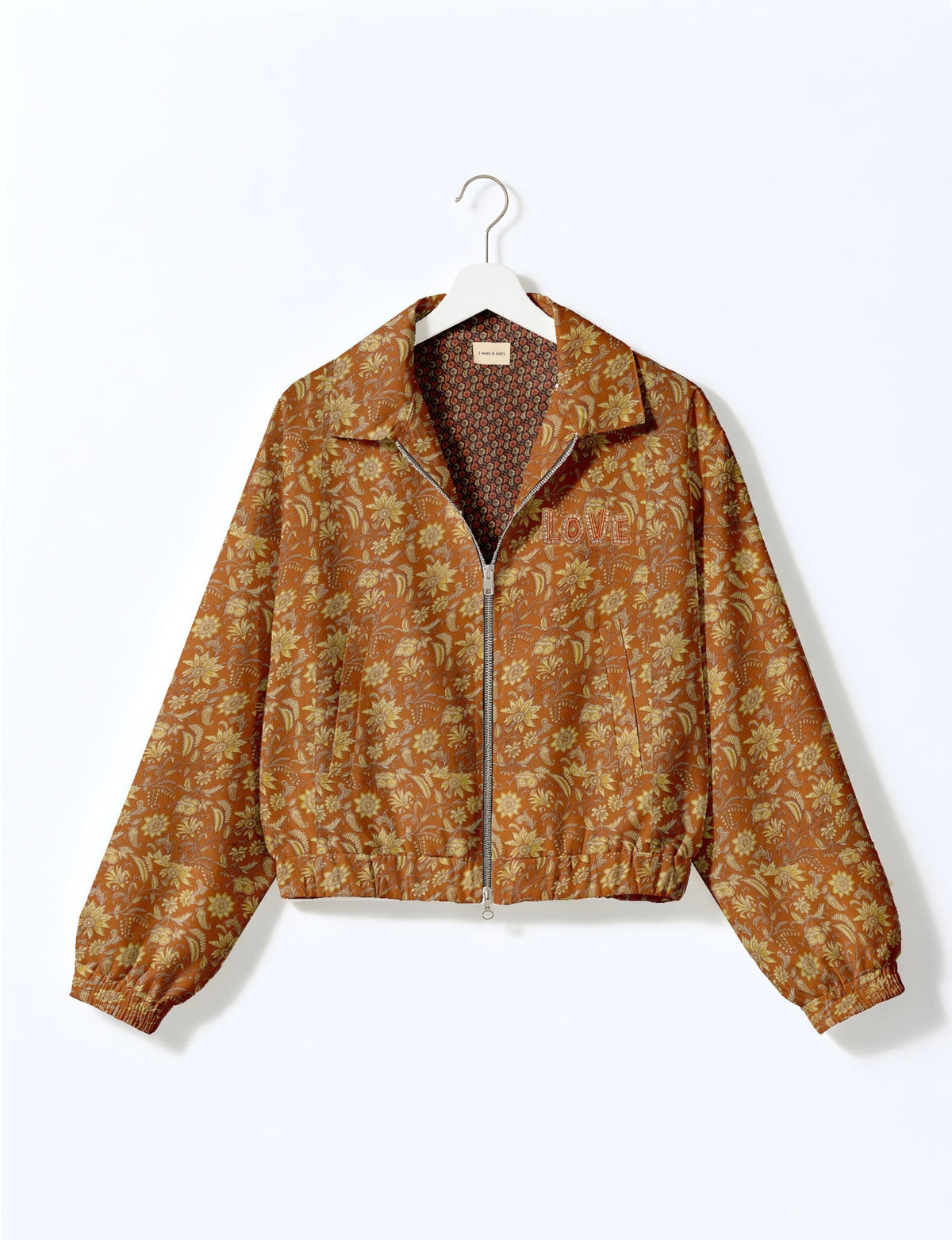 Love Bomber Jacket made from recycled fabric, featuring hand-stitched Aari embroidery. A unique piece of zero-waste clothing, part of the circular fashion movement. Designed with upcycled materials for a stylish yet environmentally friendly clothing choice.