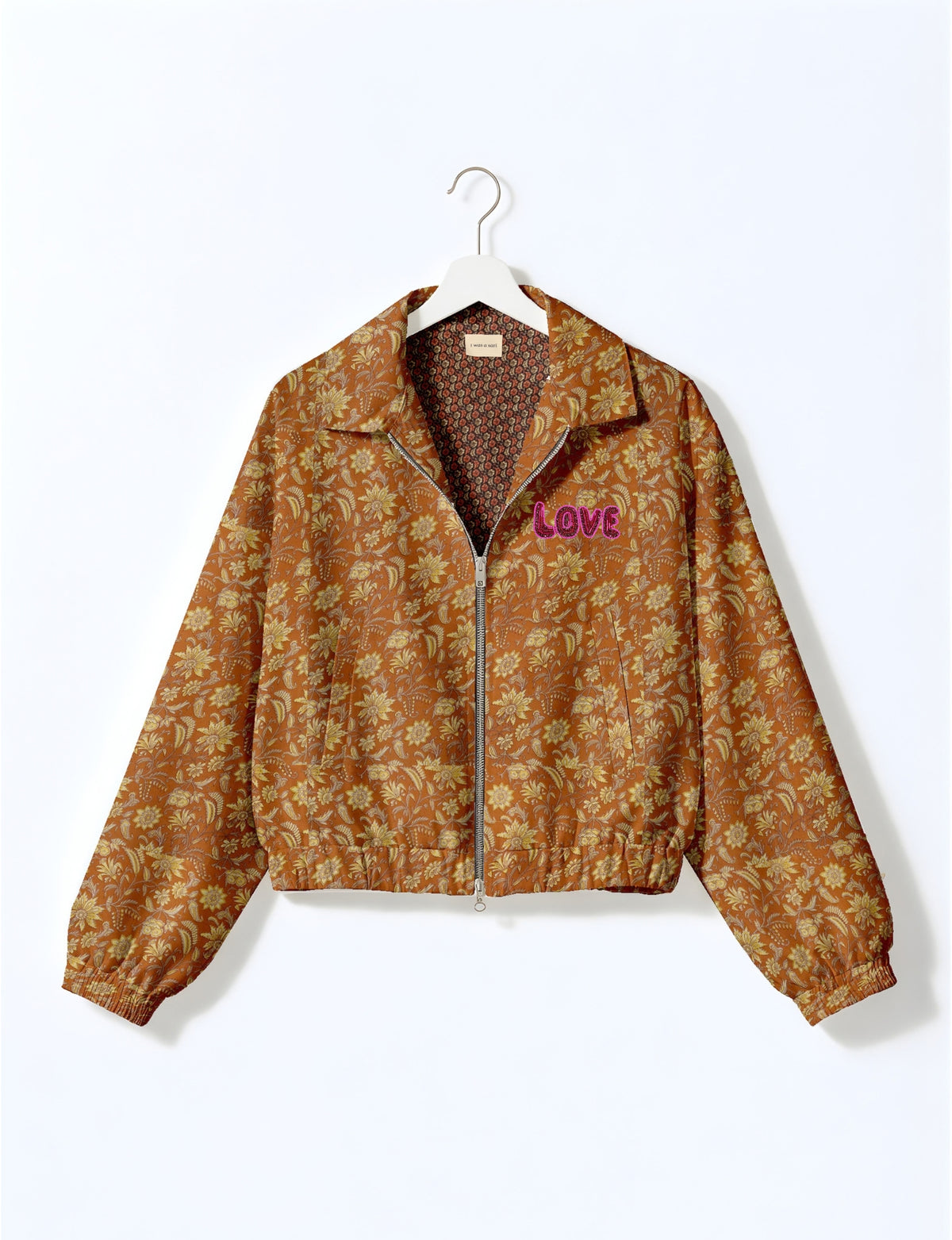 Love Bomber Jacket made from recycled fabric, featuring hand-stitched Aari embroidery. A unique piece of zero-waste clothing, part of the circular fashion movement. Designed with upcycled materials for a stylish yet environmentally friendly clothing choice.