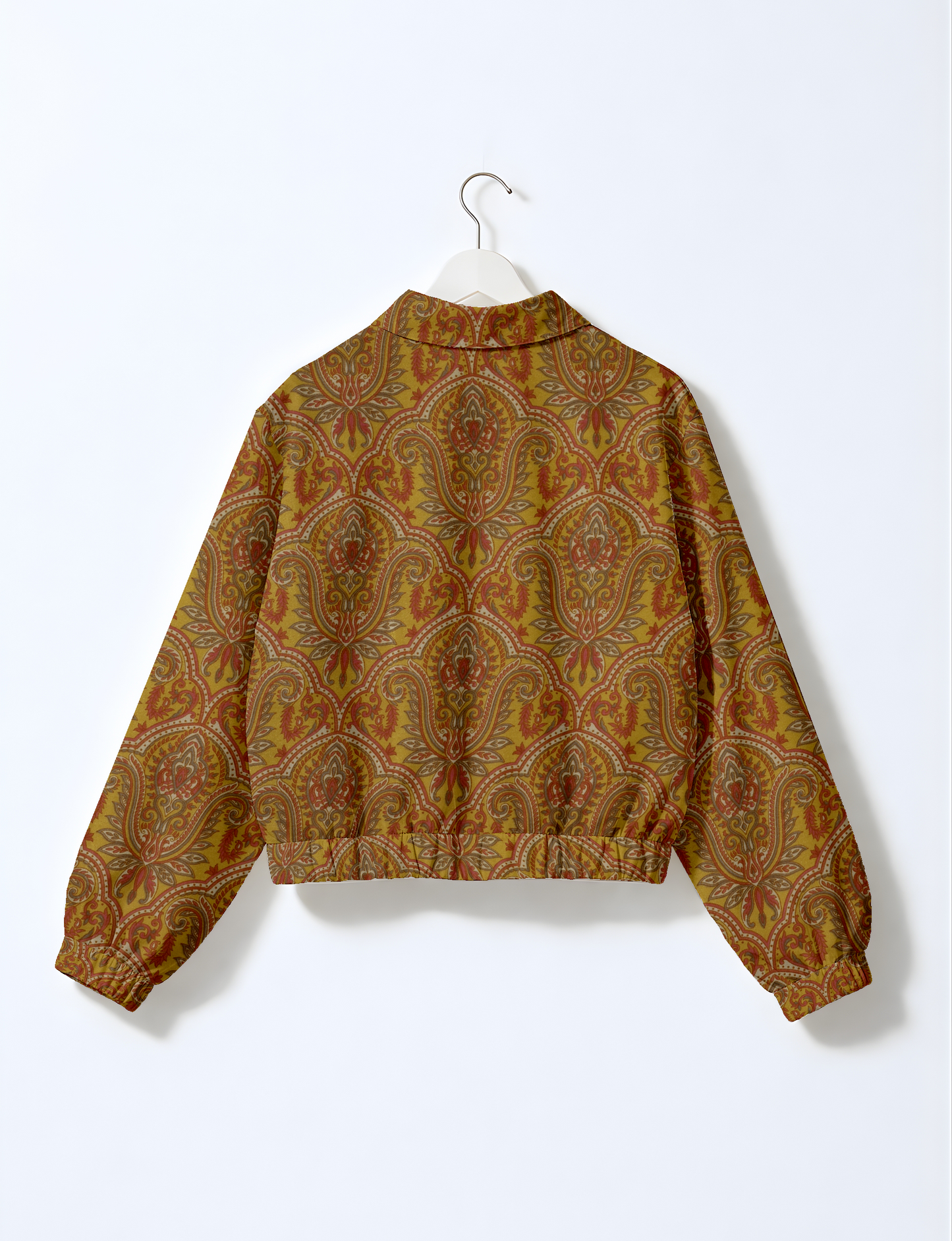 Upcycled Bomber Jacket made from recycled sari materials, featuring a cute cropped shape, elasticated hem and cuffs, and contrast sari print lining. Sustainable apparel promoting eco-friendly fashion and ethical clothing.