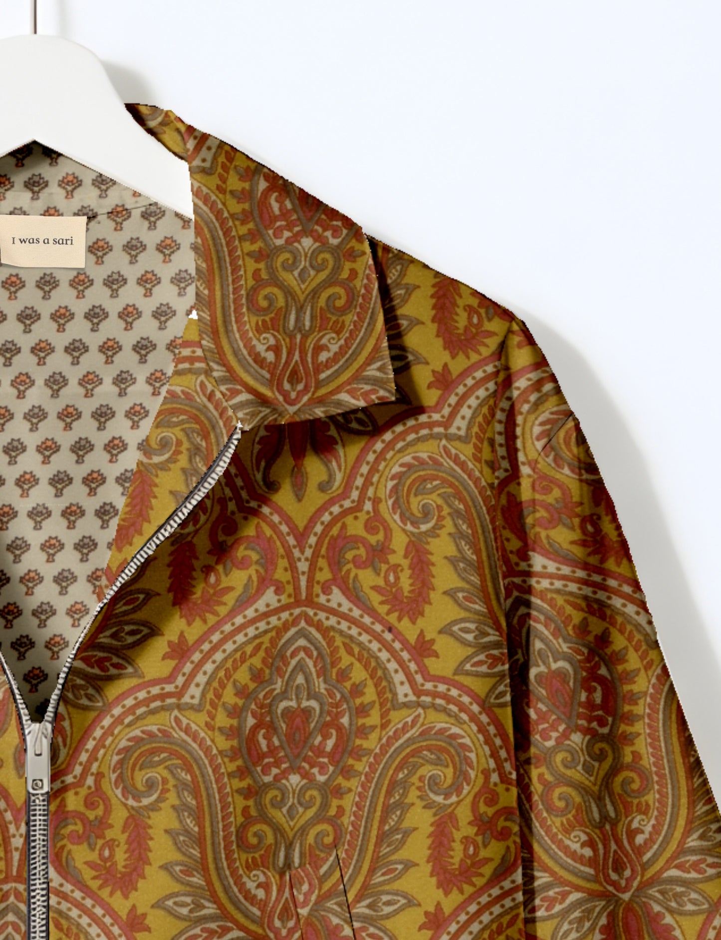 Upcycled Bomber Jacket made from recycled sari materials, featuring a cute cropped shape, elasticated hem and cuffs, and contrast sari print lining. Sustainable apparel promoting eco-friendly fashion and ethical clothing.