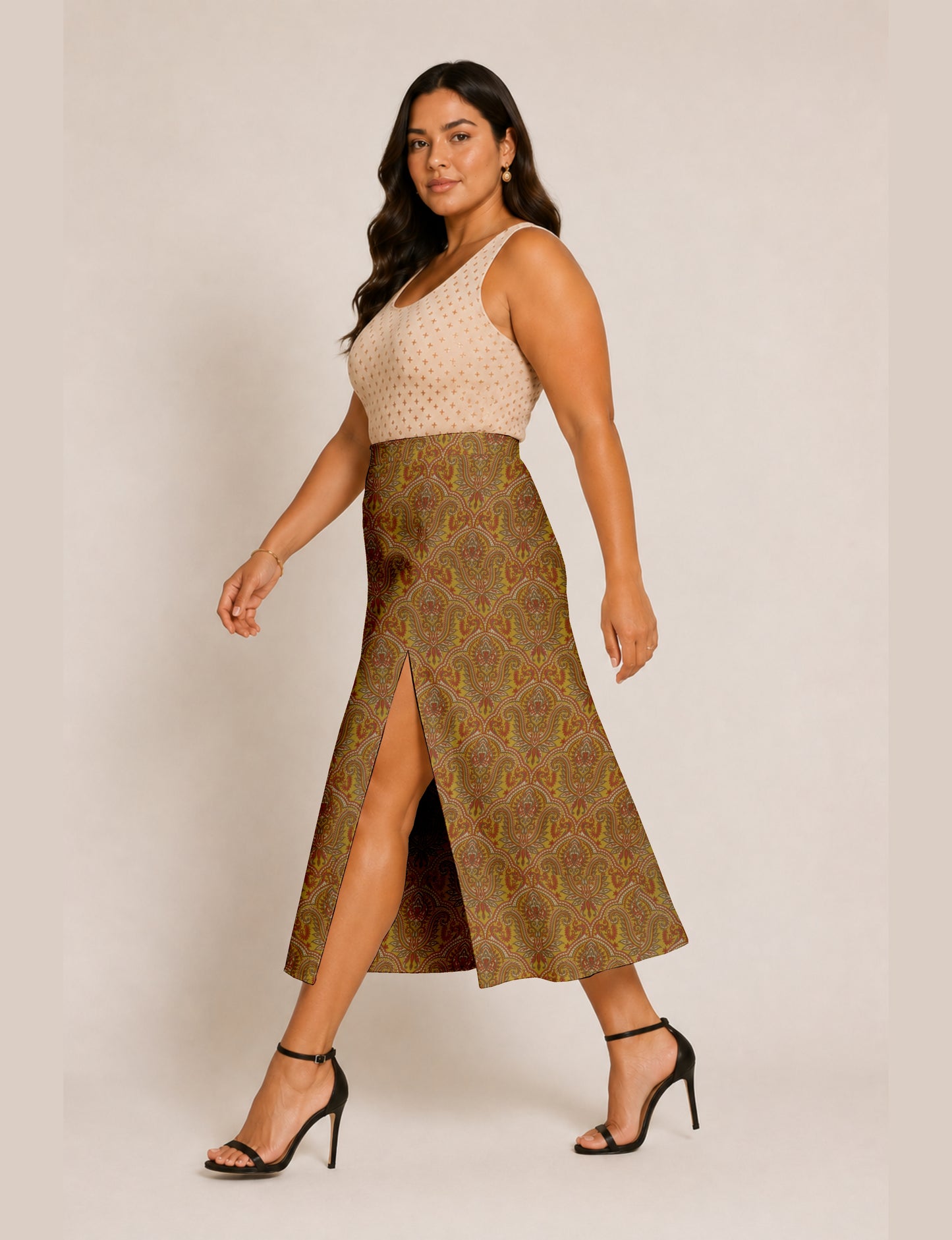 Midi A-line skirt with front slit, fitted waistband, concealed side closure, and below mid-calf length silhouette.