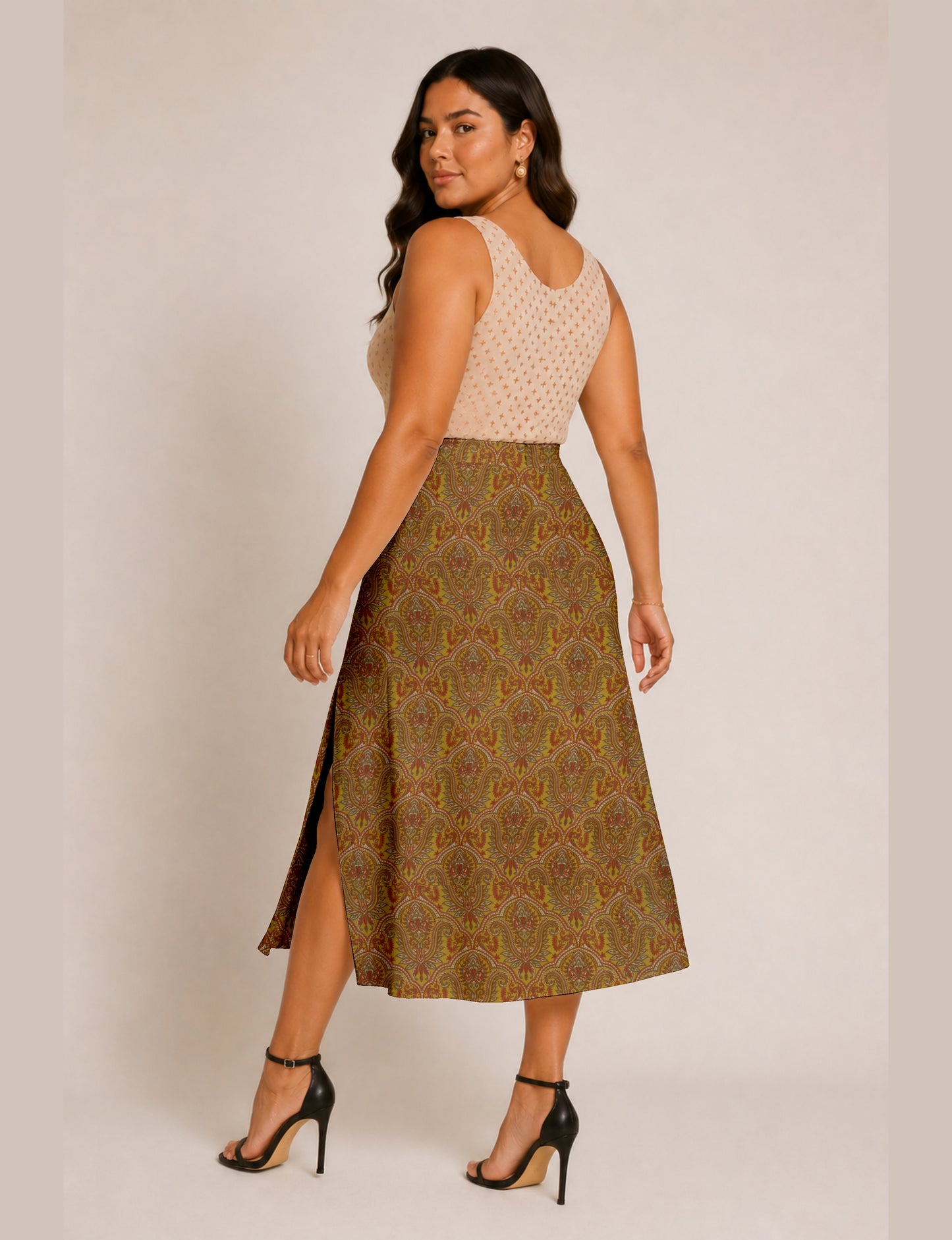 Midi A-line skirt with front slit, fitted waistband, concealed side closure, and below mid-calf length silhouette.