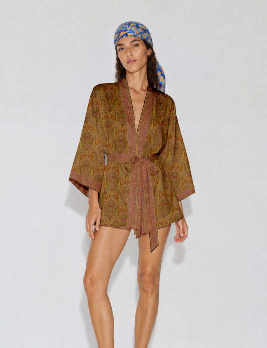 Short kimono robe with wrap front, V-neckline, wide sleeves, waist tie, and concealed skort detail.