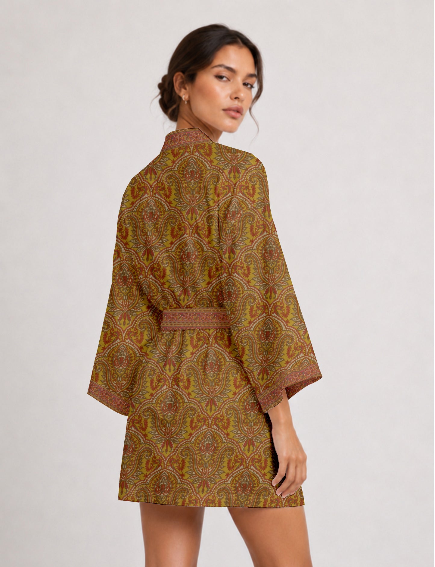 Short kimono robe with wrap front, V-neckline, wide sleeves, waist tie, and concealed skort detail.