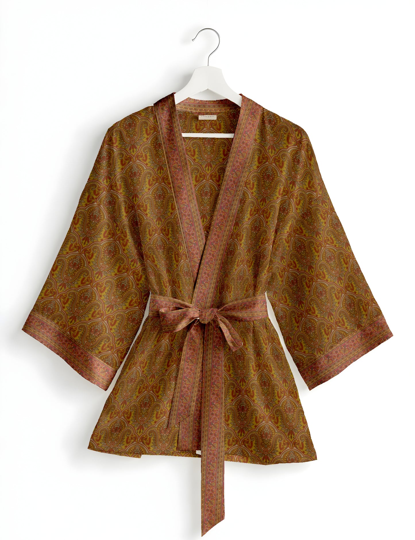 Short kimono robe with wrap front, V-neckline, wide sleeves, waist tie, and concealed skort detail.