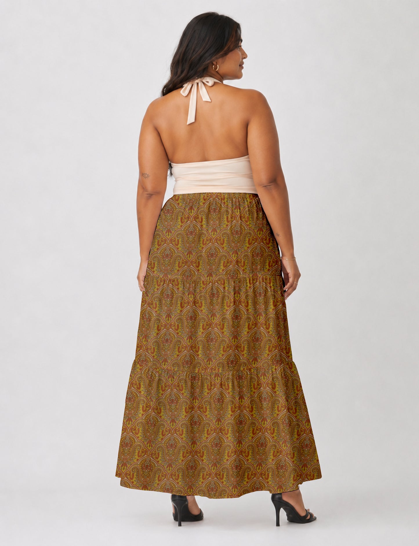 Midi tiered skirt with fitted waistband, soft knife pleats, flared silhouette, side seam pockets, and ankle-length hem