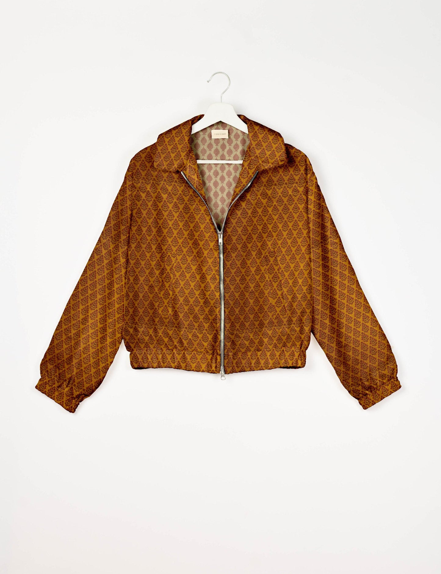 Upcycled Bomber Jacket made from recycled sari materials, featuring a cute cropped shape, elasticated hem and cuffs, and contrast sari print lining. Sustainable apparel promoting eco-friendly fashion and ethical clothing.