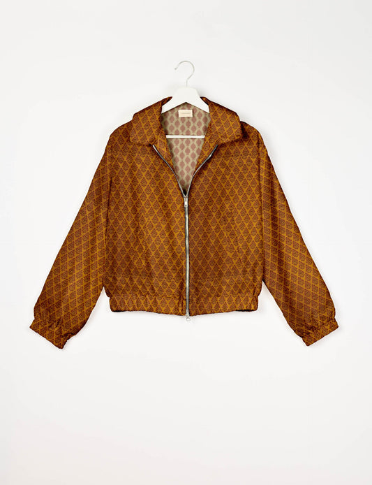 Upcycled Bomber Jacket made from recycled sari materials, featuring a cute cropped shape, elasticated hem and cuffs, and contrast sari print lining. Sustainable apparel promoting eco-friendly fashion and ethical clothing.