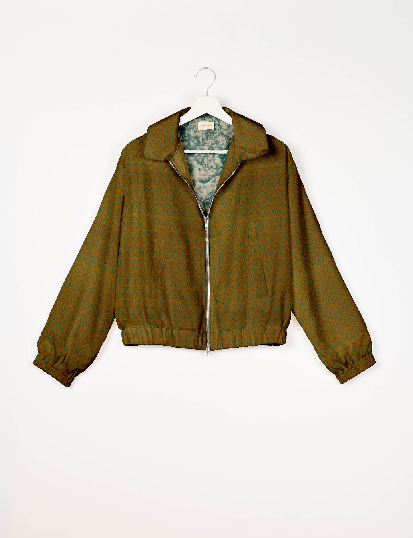 Upcycled Bomber Jacket made from recycled sari materials, featuring a cute cropped shape, elasticated hem and cuffs, and contrast sari print lining. Sustainable apparel promoting eco-friendly fashion and ethical clothing.