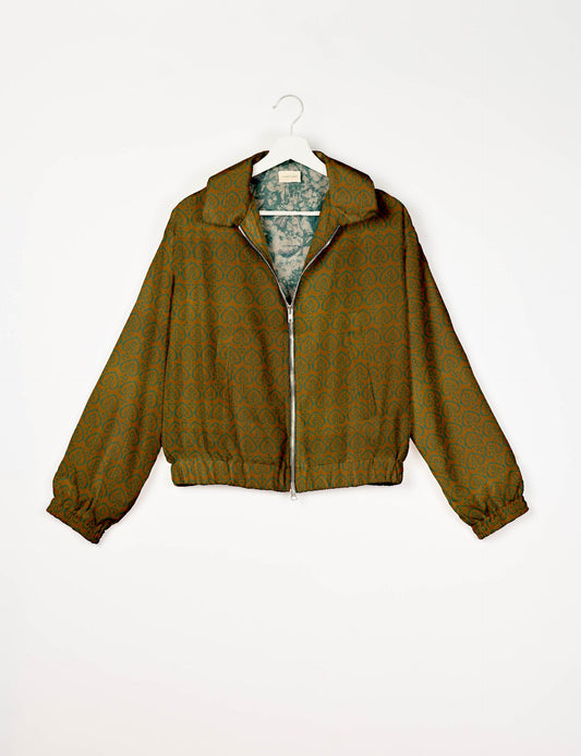 Upcycled Bomber Jacket made from recycled sari materials, featuring a cute cropped shape, elasticated hem and cuffs, and contrast sari print lining. Sustainable apparel promoting eco-friendly fashion and ethical clothing.