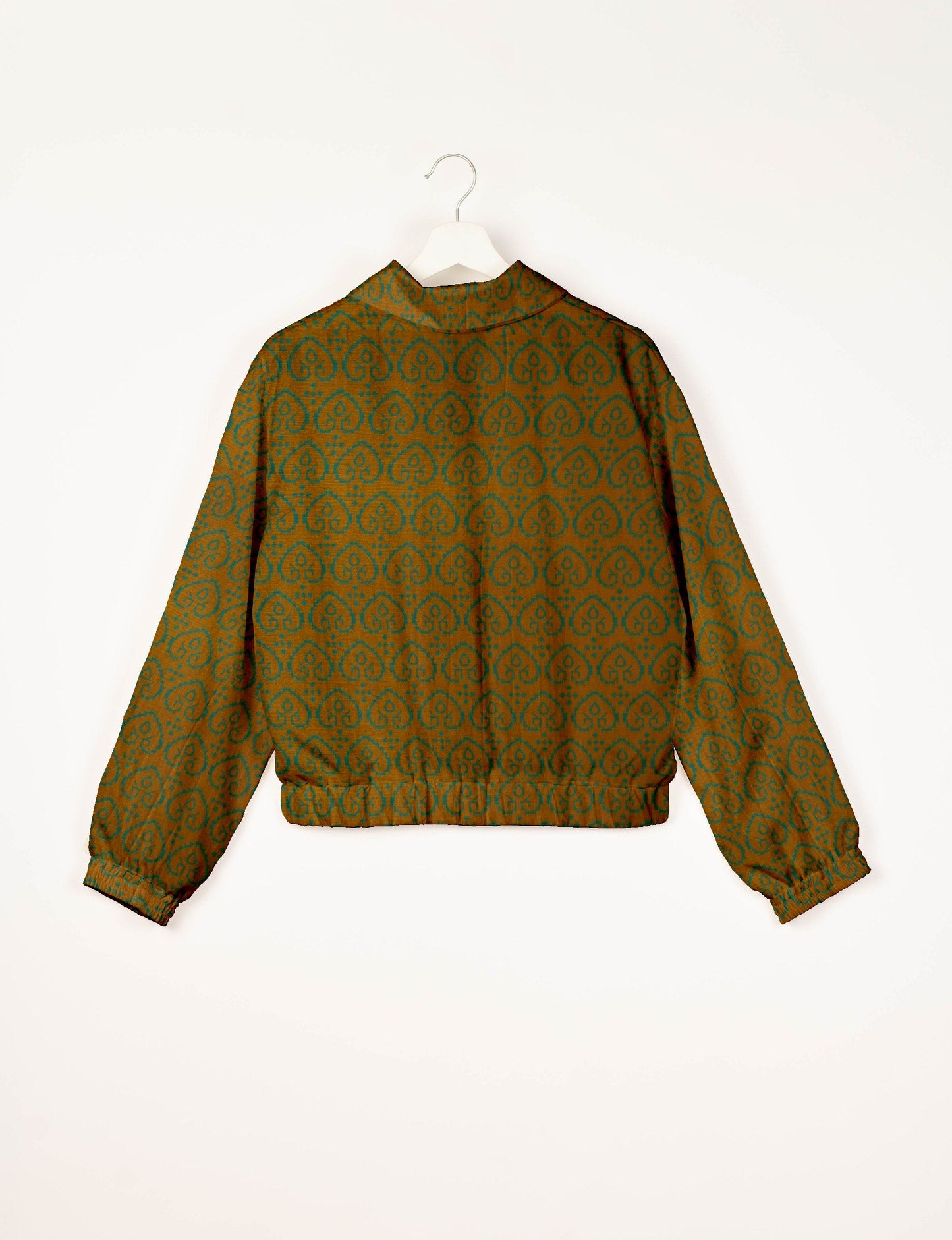 Upcycled Bomber Jacket made from recycled sari materials, featuring a cute cropped shape, elasticated hem and cuffs, and contrast sari print lining. Sustainable apparel promoting eco-friendly fashion and ethical clothing.