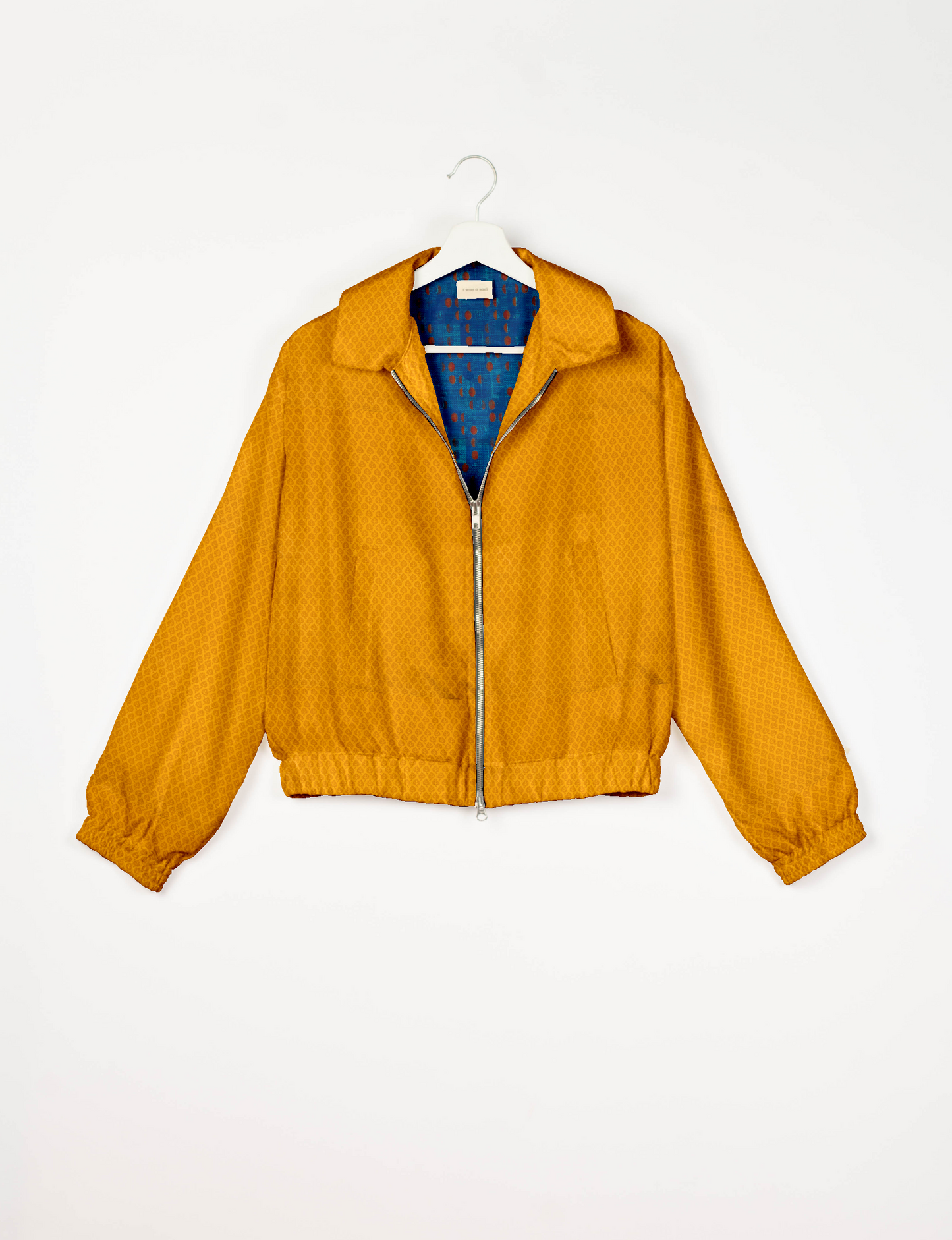 Upcycled Bomber Jacket made from recycled sari materials, featuring a cute cropped shape, elasticated hem and cuffs, and contrast sari print lining. Sustainable apparel promoting eco-friendly fashion and ethical clothing.