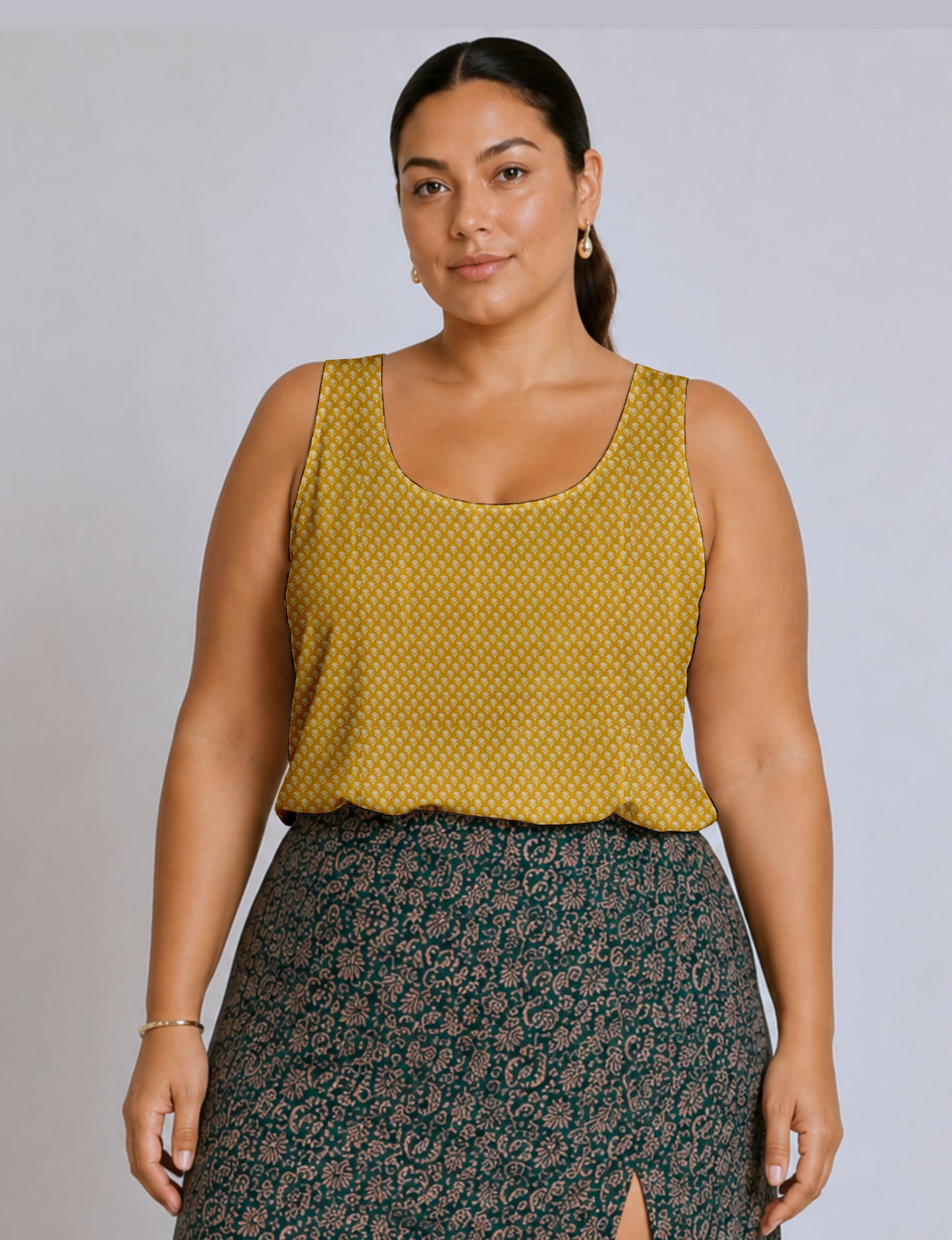 Women's sleeveless blouse with a relaxed straight fit, wide scoop neckline, deep scoop back, and hip-length silhouette.