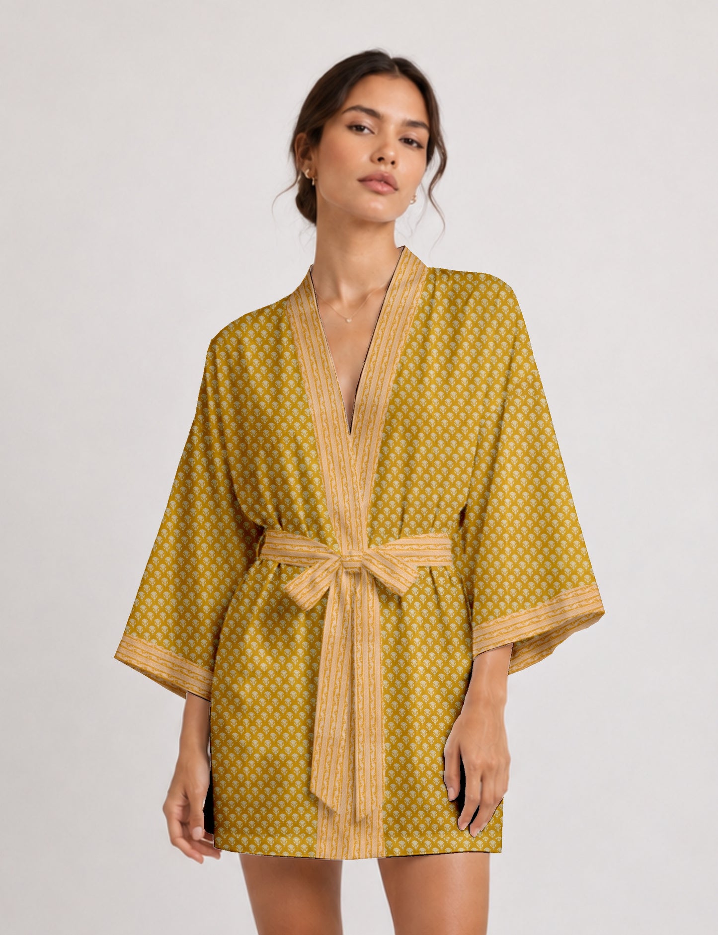 Short kimono robe with wrap front, V-neckline, wide sleeves, waist tie, and concealed skort detail.