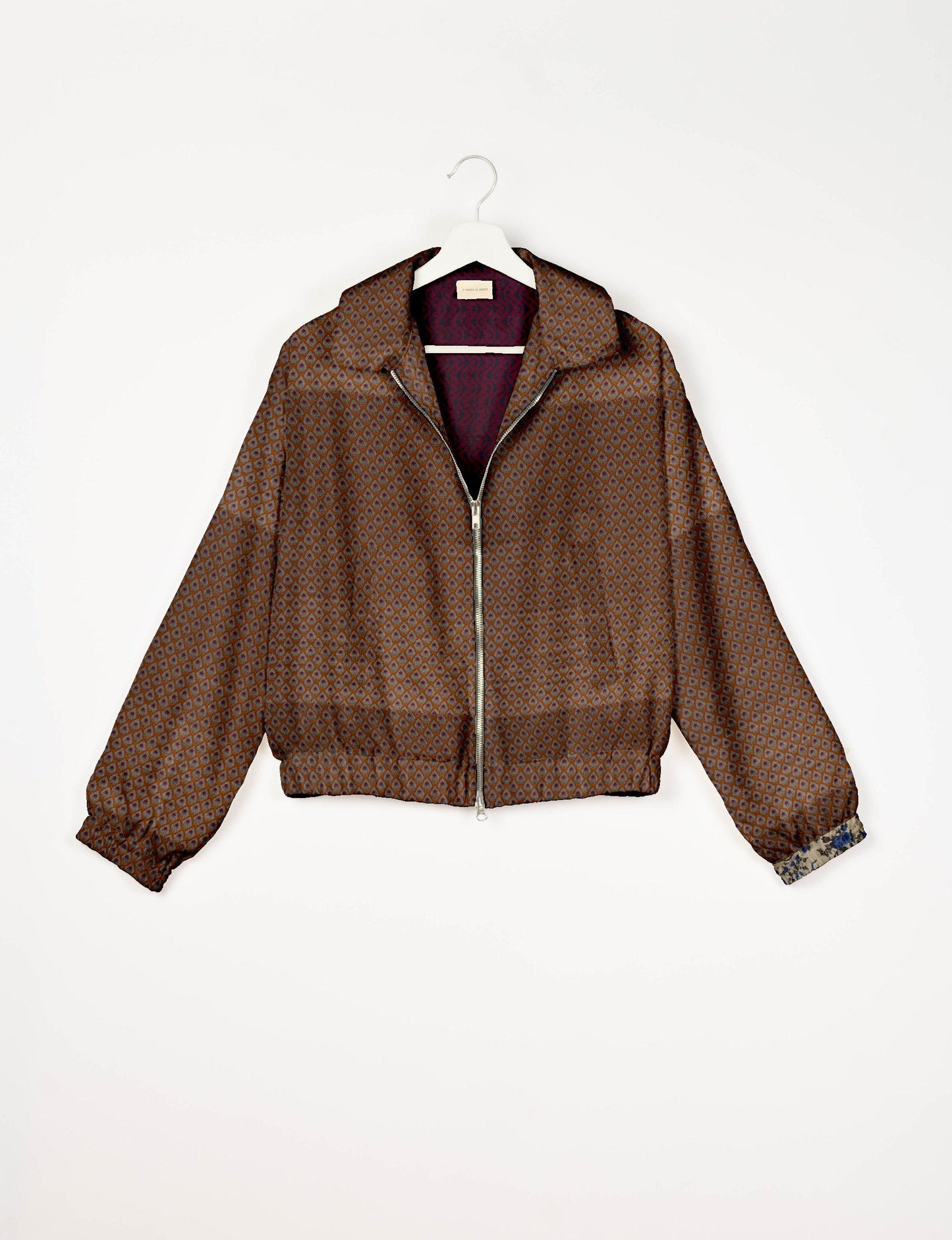 Upcycled Bomber Jacket made from recycled sari materials, featuring a cute cropped shape, elasticated hem and cuffs, and contrast sari print lining. Sustainable apparel promoting eco-friendly fashion and ethical clothing.