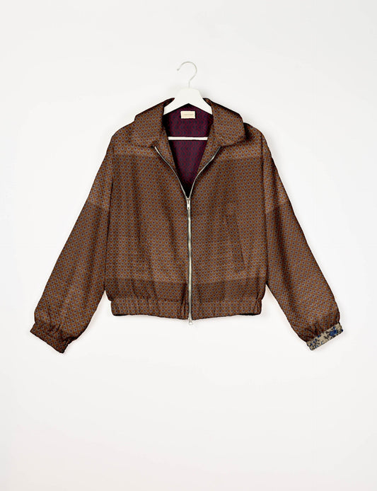 Upcycled Bomber Jacket made from recycled sari materials, featuring a cute cropped shape, elasticated hem and cuffs, and contrast sari print lining. Sustainable apparel promoting eco-friendly fashion and ethical clothing.