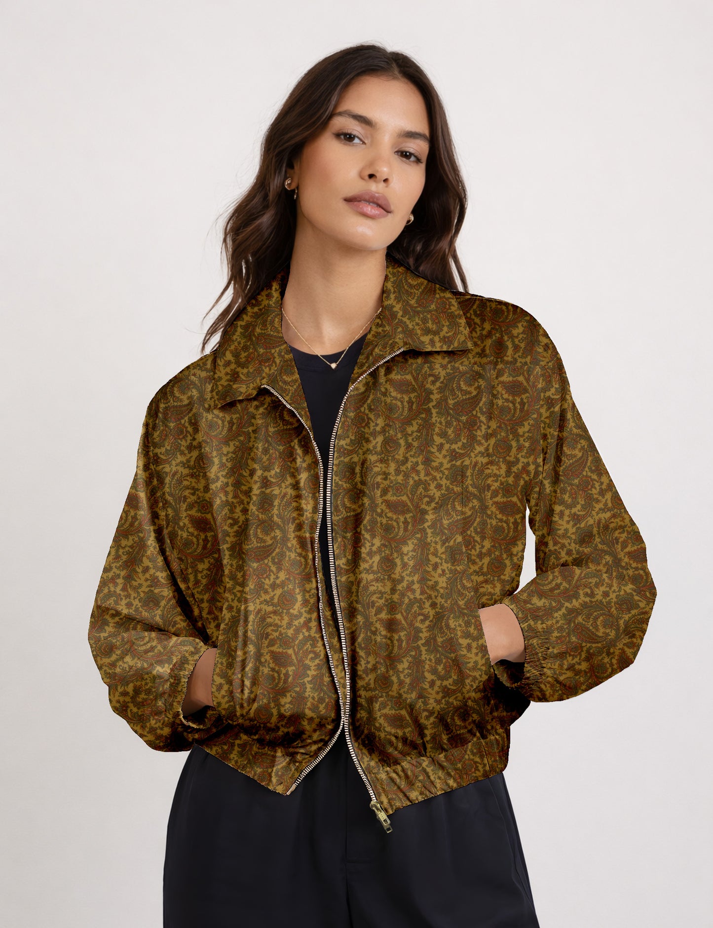 Woman wearing a yellow floral bomber jacket with front zipper, elastic cuffs, and side pockets, shown from front view