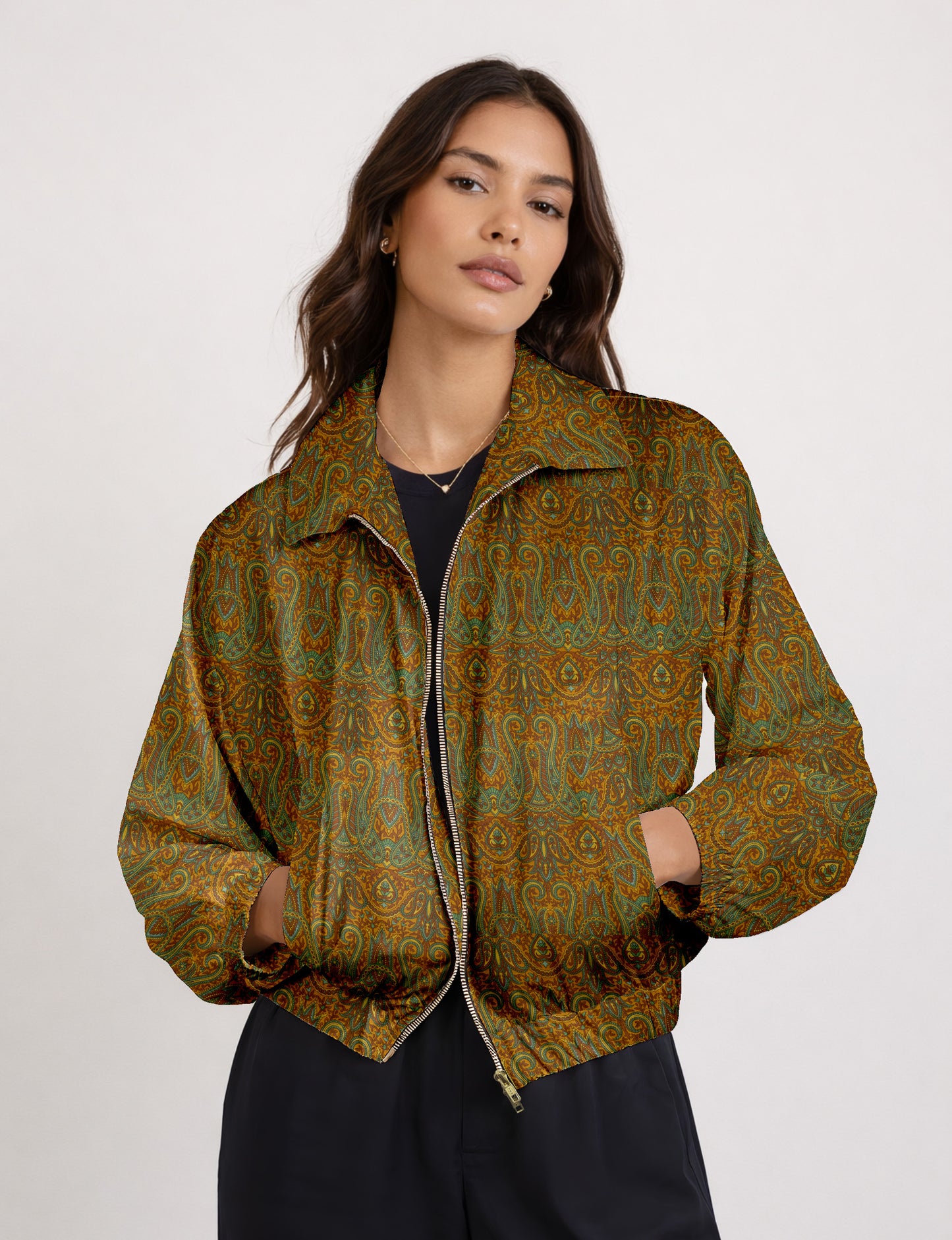 Women's cropped bomber jacket with twin metallic front zippers, welt pockets, elasticated hem and cuffs, and contrast sari print lining.