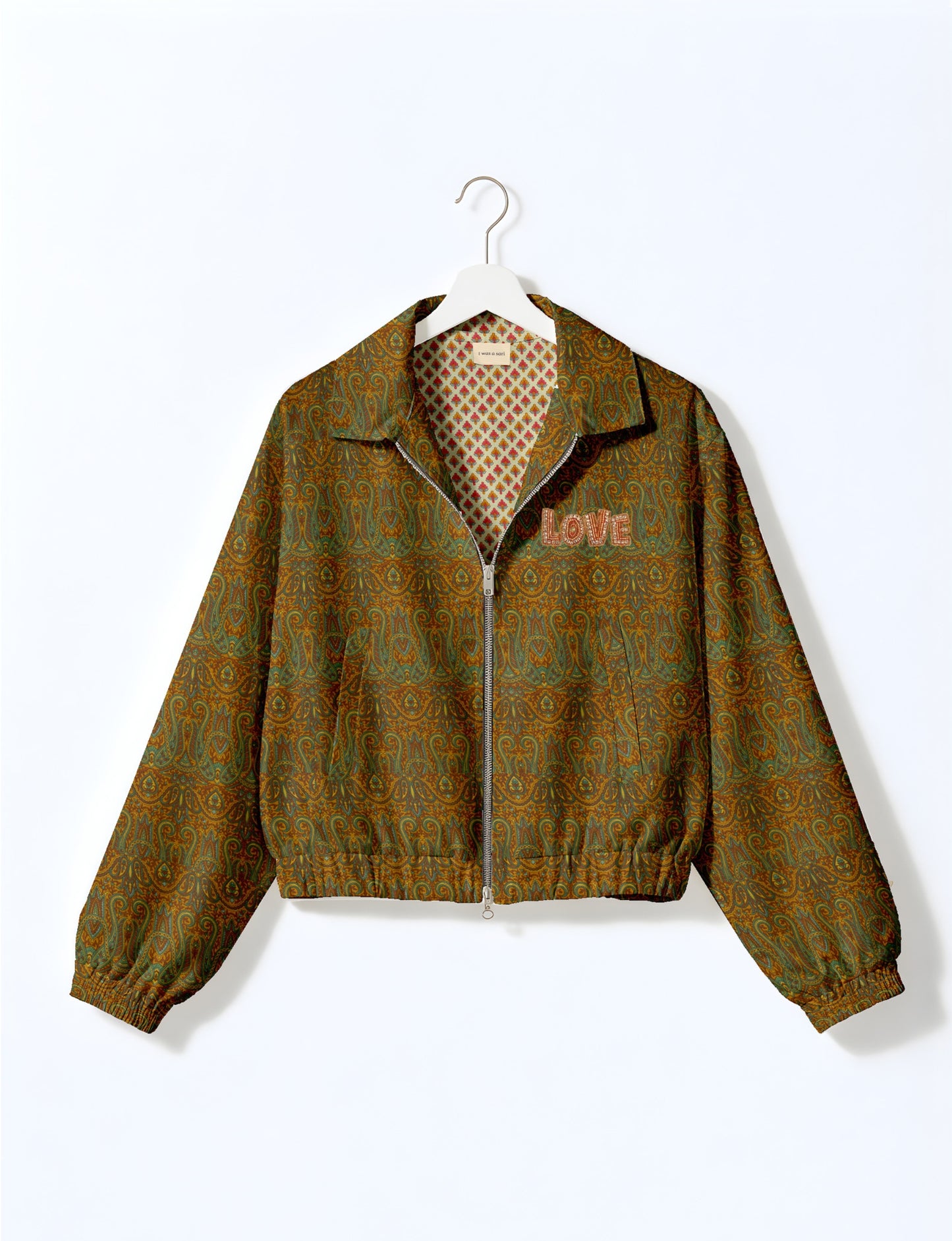 Love Bomber Jacket made from recycled fabric, featuring hand-stitched Aari embroidery. A unique piece of zero-waste clothing, part of the circular fashion movement. Designed with upcycled materials for a stylish yet environmentally friendly clothing choice.