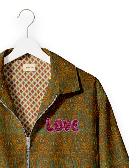 Love Bomber Jacket made from recycled fabric, featuring hand-stitched Aari embroidery. A unique piece of zero-waste clothing, part of the circular fashion movement. Designed with upcycled materials for a stylish yet environmentally friendly clothing choice.