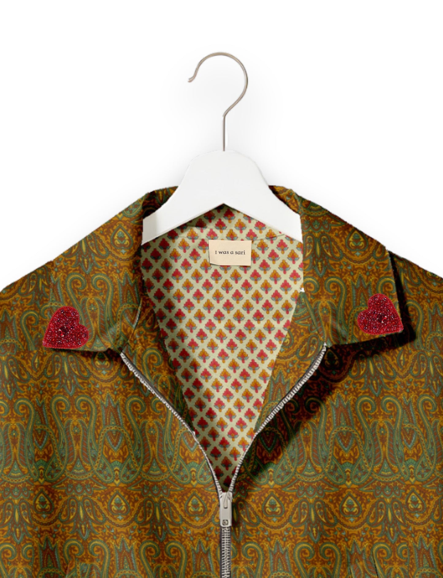 Make a bold statement with our Heart Drop Earrings, a symbol of conscious luxury and ethical fashion. Handcrafted using the intricate Aari embroidery technique, these earrings are made from upcycled sari fabric, embracing slow fashion and zero waste clothing. Elevate your look with sustainable apparel that supports fair trade fashion while reducing textile waste. Choose eco-friendly fashion that speaks of love, artistry, and responsibility.