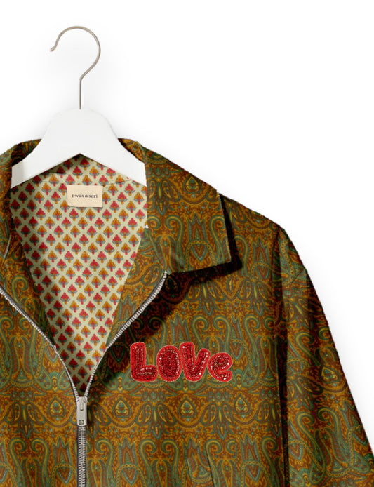 Love Bomber Jacket made from recycled fabric, featuring hand-stitched Aari embroidery. A unique piece of zero-waste clothing, part of the circular fashion movement. Designed with upcycled materials for a stylish yet environmentally friendly clothing choice.
