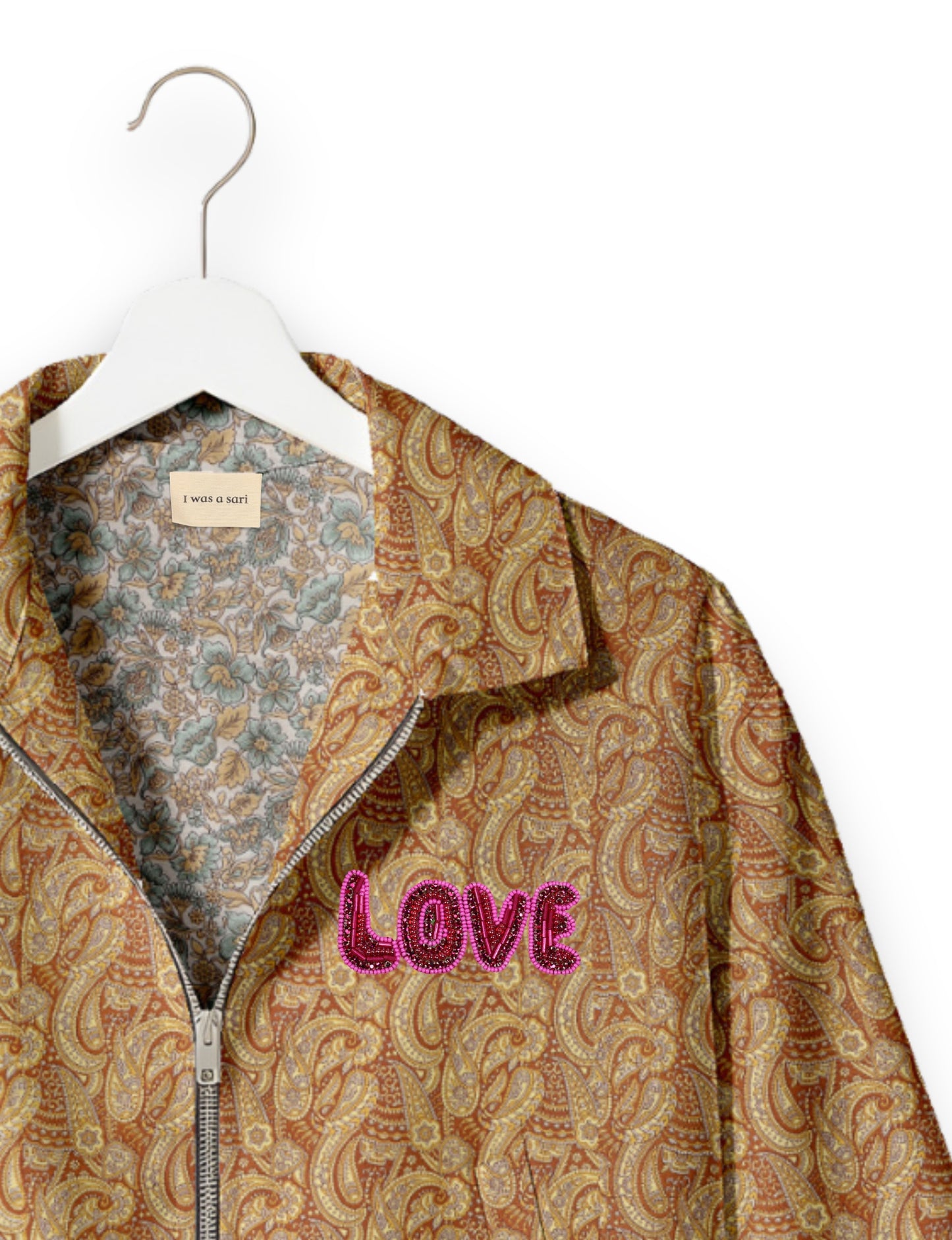 Love Bomber Jacket made from recycled fabric, featuring hand-stitched Aari embroidery. A unique piece of zero-waste clothing, part of the circular fashion movement. Designed with upcycled materials for a stylish yet environmentally friendly clothing choice.