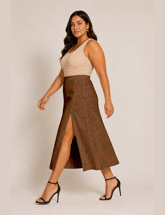 Woman wearing a yellow and black micro patterned A-line skirt with front slit, paired with beige sleeveless top and black