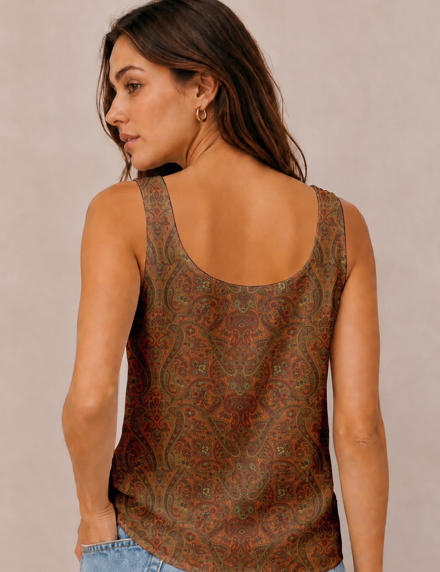Women's sleeveless blouse with a relaxed straight fit, wide scoop neckline, deep scoop back, and hip-length silhouette.