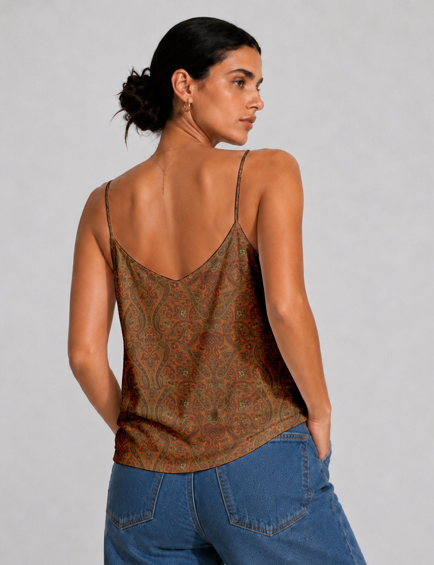 Women's sleeveless slip top with a relaxed straight fit, soft V-neckline, deep V-back, and delicate spaghetti straps.