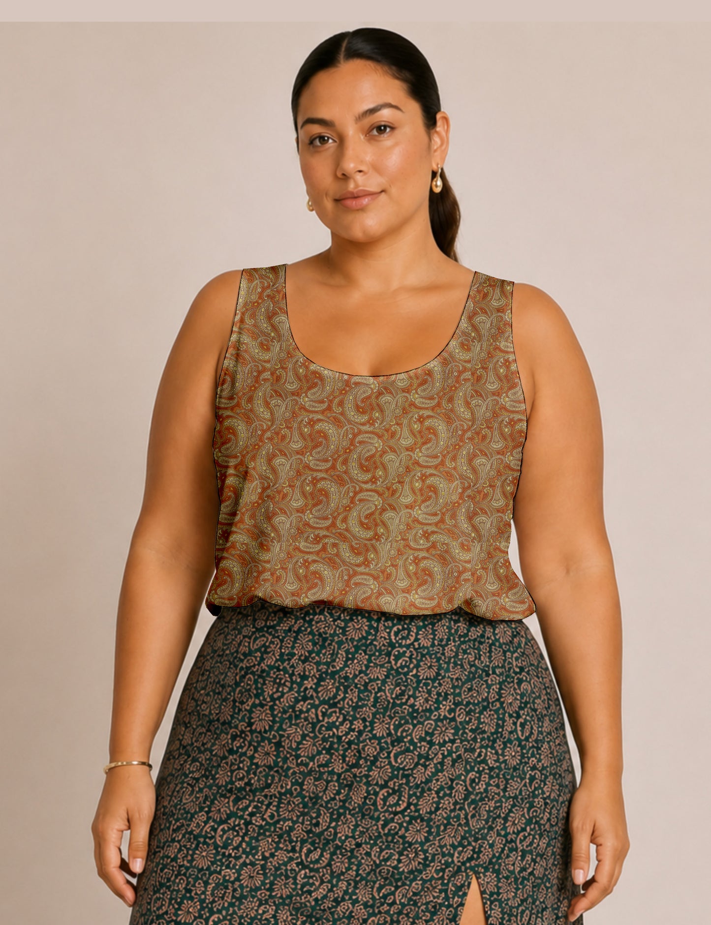 Women's sleeveless blouse with a relaxed straight fit, wide scoop neckline, deep scoop back, and hip-length silhouette.