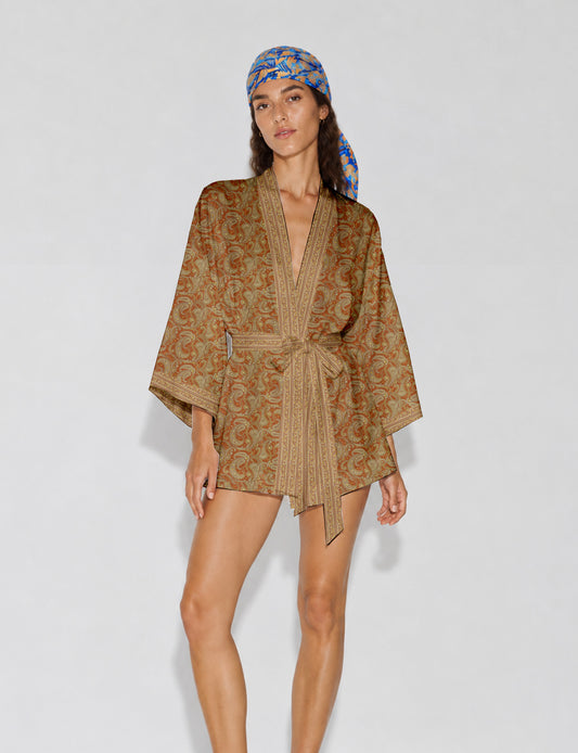 Short kimono robe with wrap front, V-neckline, wide sleeves, waist tie, and concealed skort detail.
