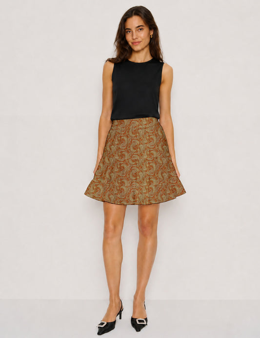 Short tiered skirt with a fitted waistband, knife pleats, softly flared silhouette, side seam pockets, and above-the-knee length.