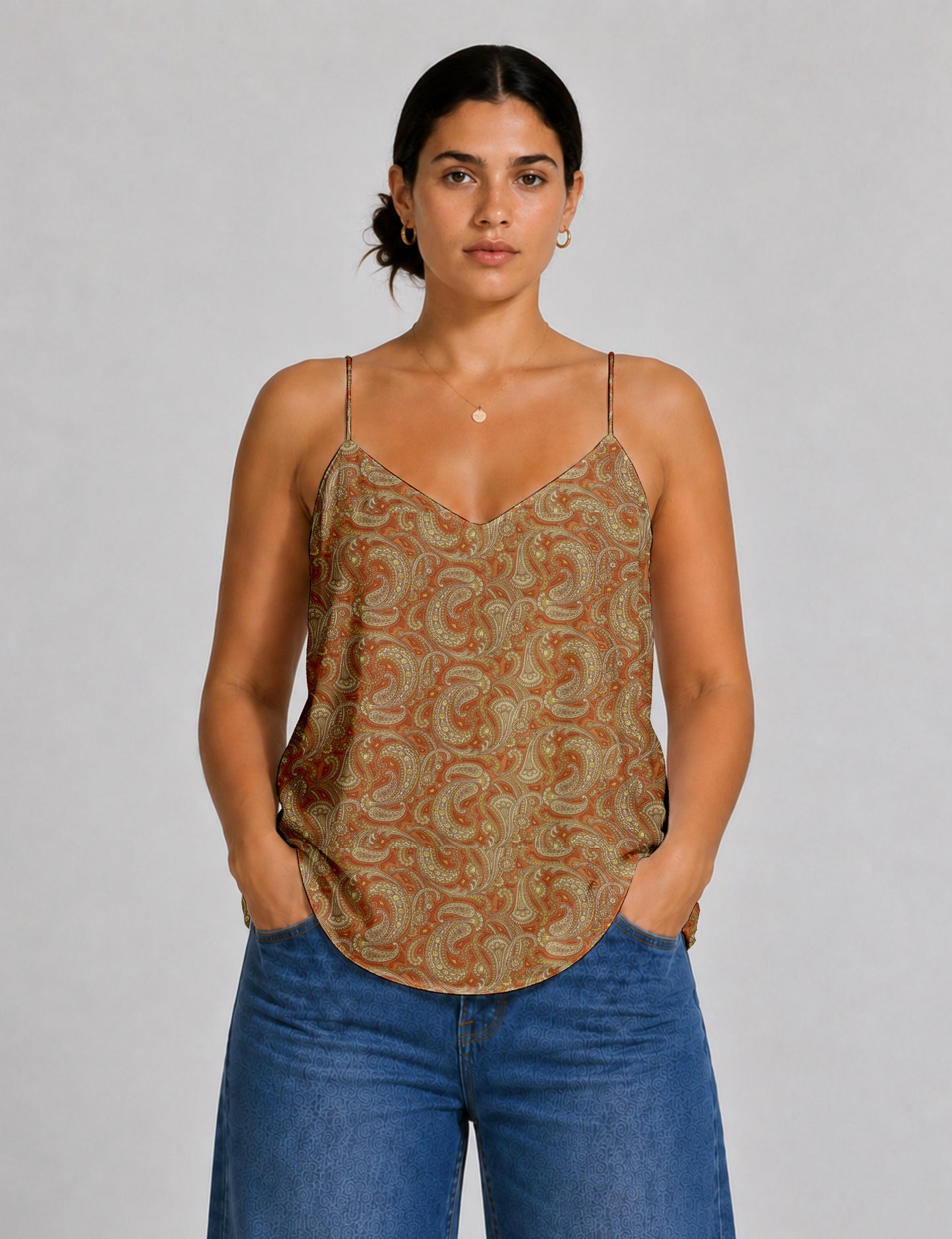 Women's sleeveless slip top with a relaxed straight fit, soft V-neckline, deep V-back, and delicate spaghetti straps.