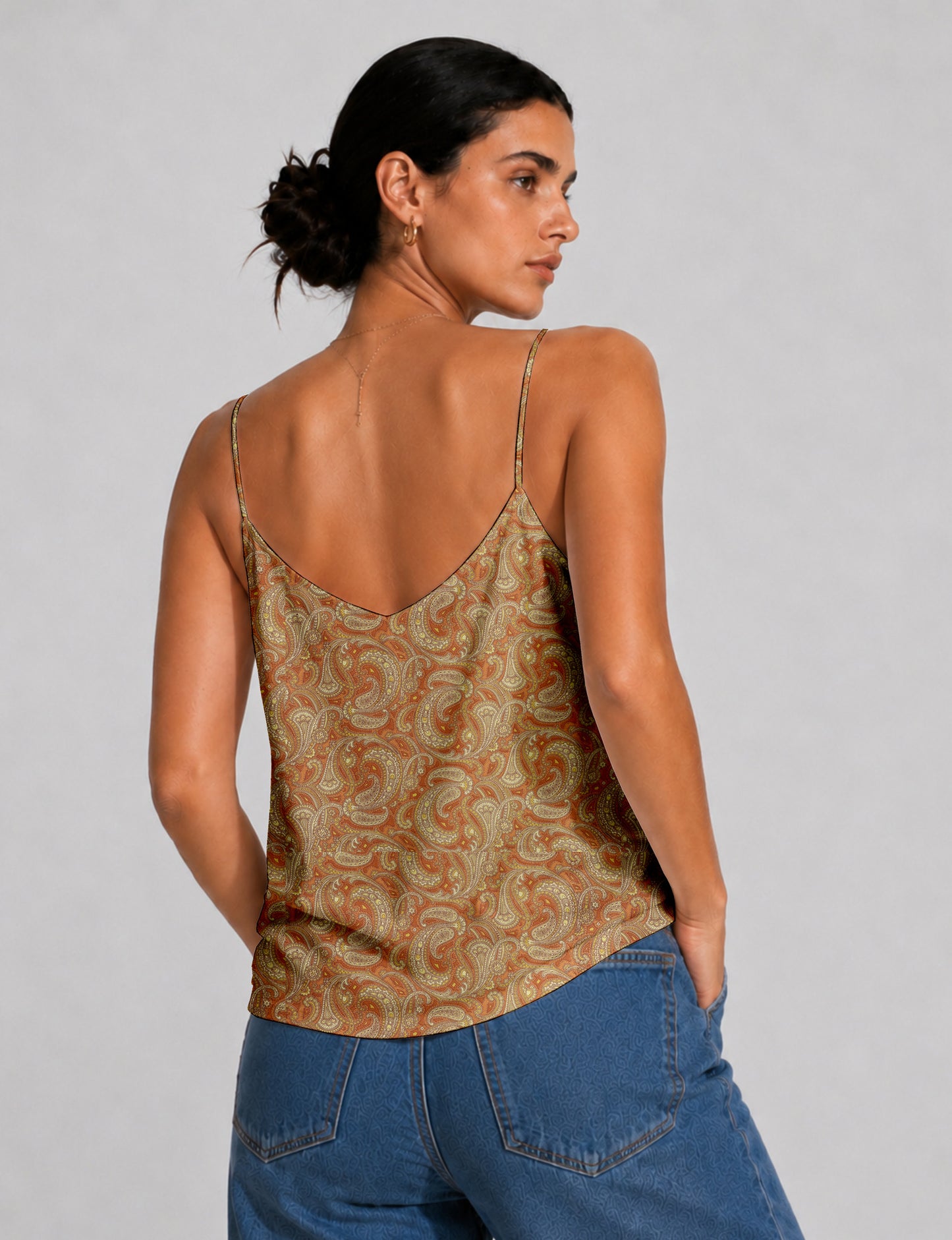 Women's sleeveless slip top with a relaxed straight fit, soft V-neckline, deep V-back, and delicate spaghetti straps.