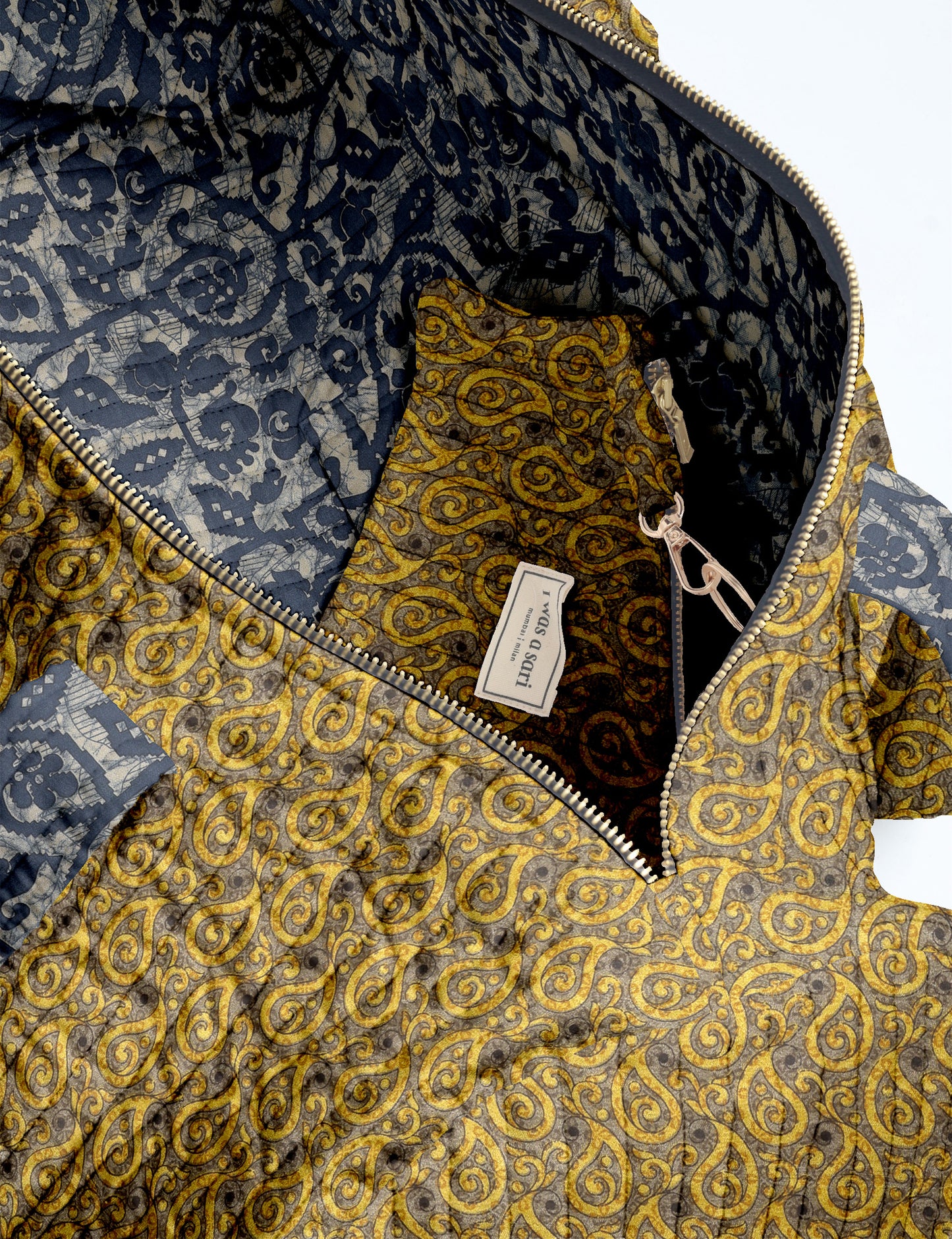 Brown paisley quilted bowling bag with dual handles, front zipper pocket, and "I was a sari" label on front side