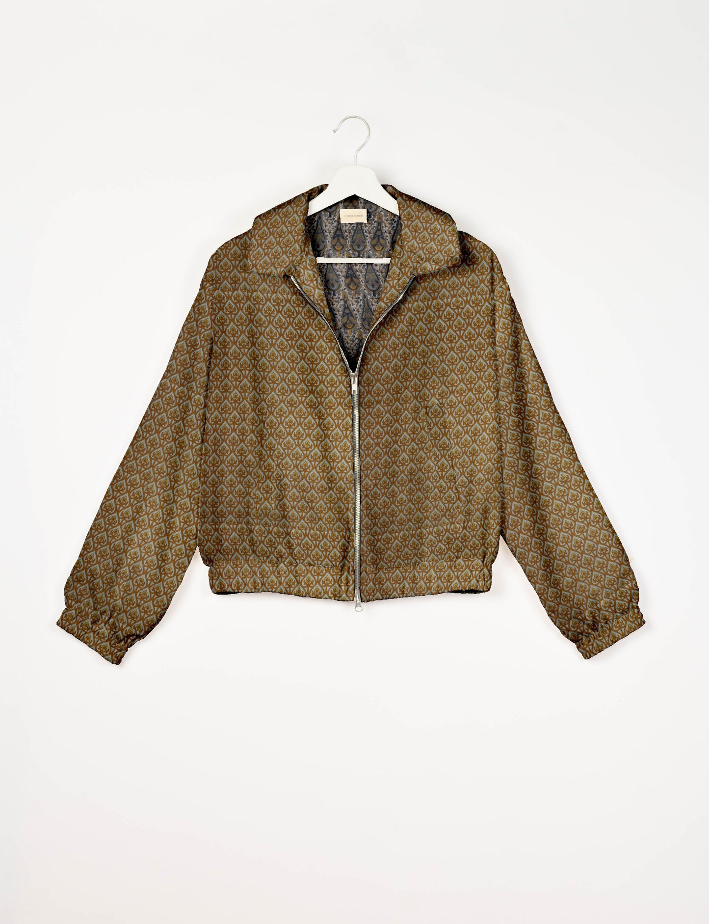 Upcycled Bomber Jacket made from recycled sari materials, featuring a cute cropped shape, elasticated hem and cuffs, and contrast sari print lining. Sustainable apparel promoting eco-friendly fashion and ethical clothing.