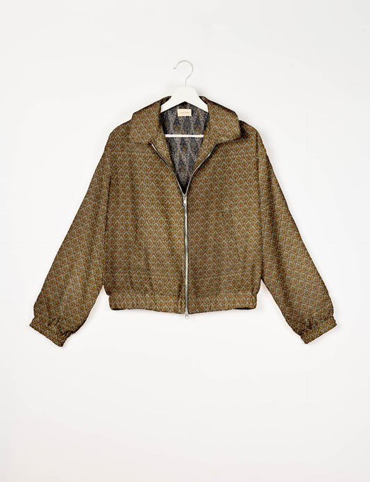 Upcycled Bomber Jacket made from recycled sari materials, featuring a cute cropped shape, elasticated hem and cuffs, and contrast sari print lining. Sustainable apparel promoting eco-friendly fashion and ethical clothing.