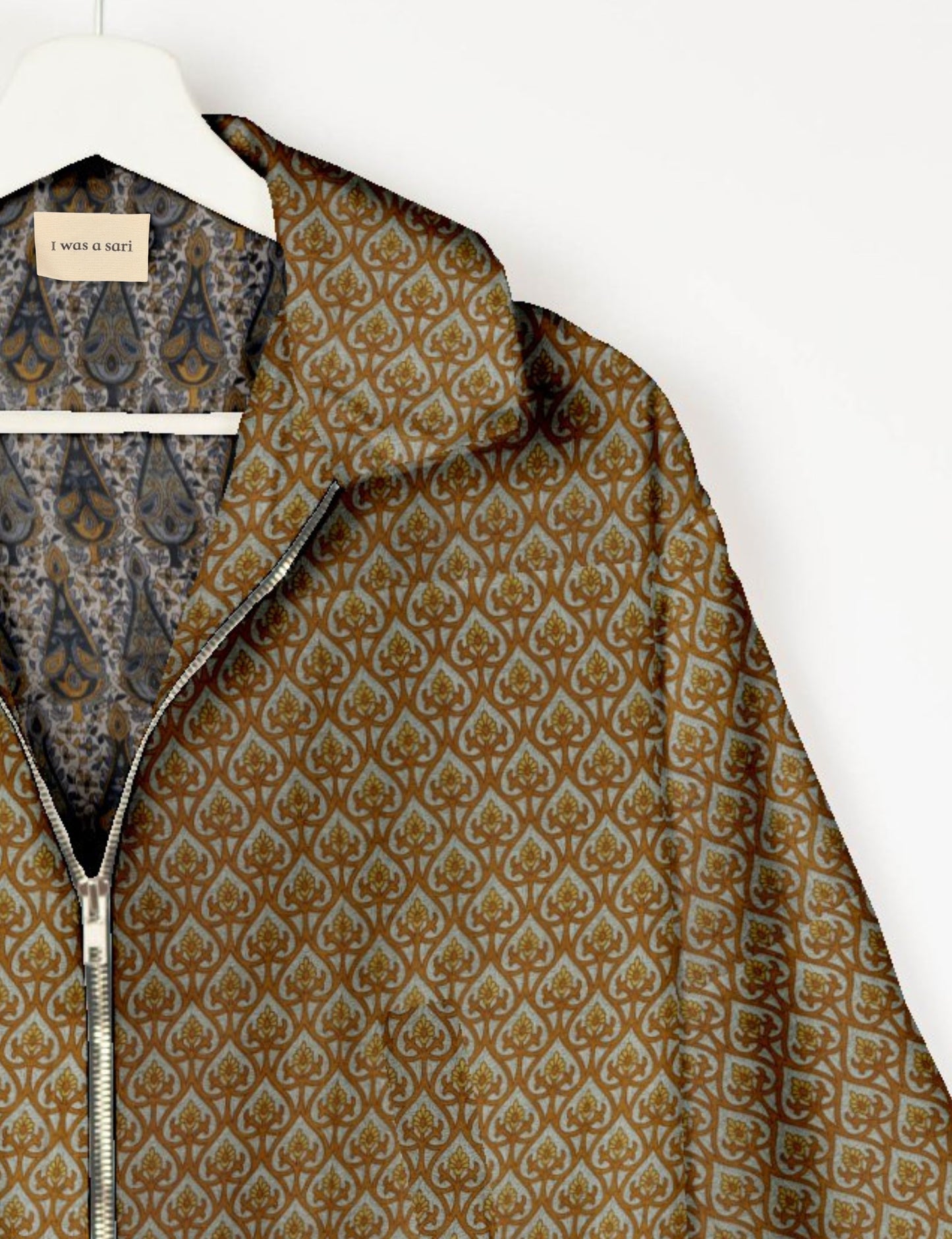 Upcycled Bomber Jacket made from recycled sari materials, featuring a cute cropped shape, elasticated hem and cuffs, and contrast sari print lining. Sustainable apparel promoting eco-friendly fashion and ethical clothing.