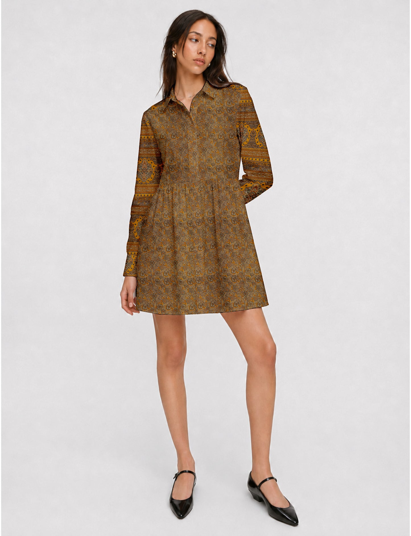 Short shirt dress with a relaxed A-line silhouette, point collar, partial button placket, gathered waist, side pockets, and full-length cuffed sleeves.