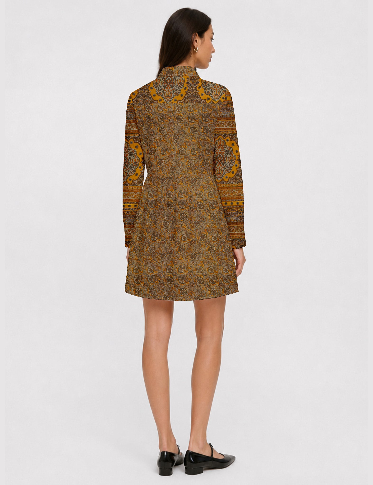 Short shirt dress with a relaxed A-line silhouette, point collar, partial button placket, gathered waist, side pockets, and full-length cuffed sleeves.