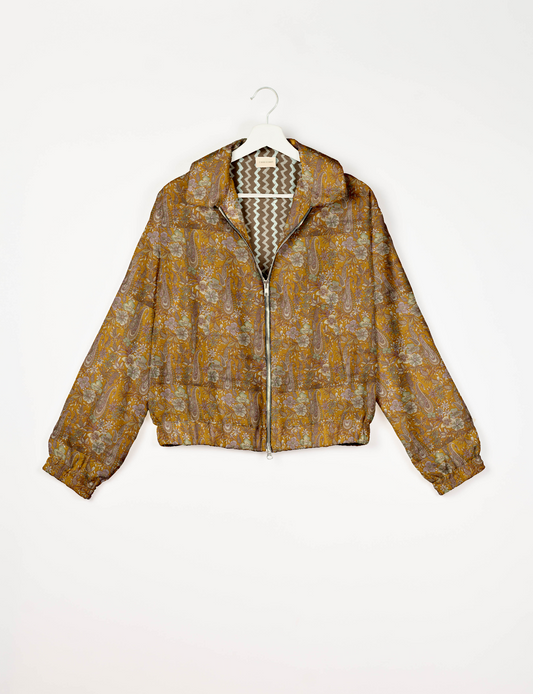Upcycled Bomber Jacket made from recycled sari materials, featuring a cute cropped shape, elasticated hem and cuffs, and contrast sari print lining. Sustainable apparel promoting eco-friendly fashion and ethical clothing.