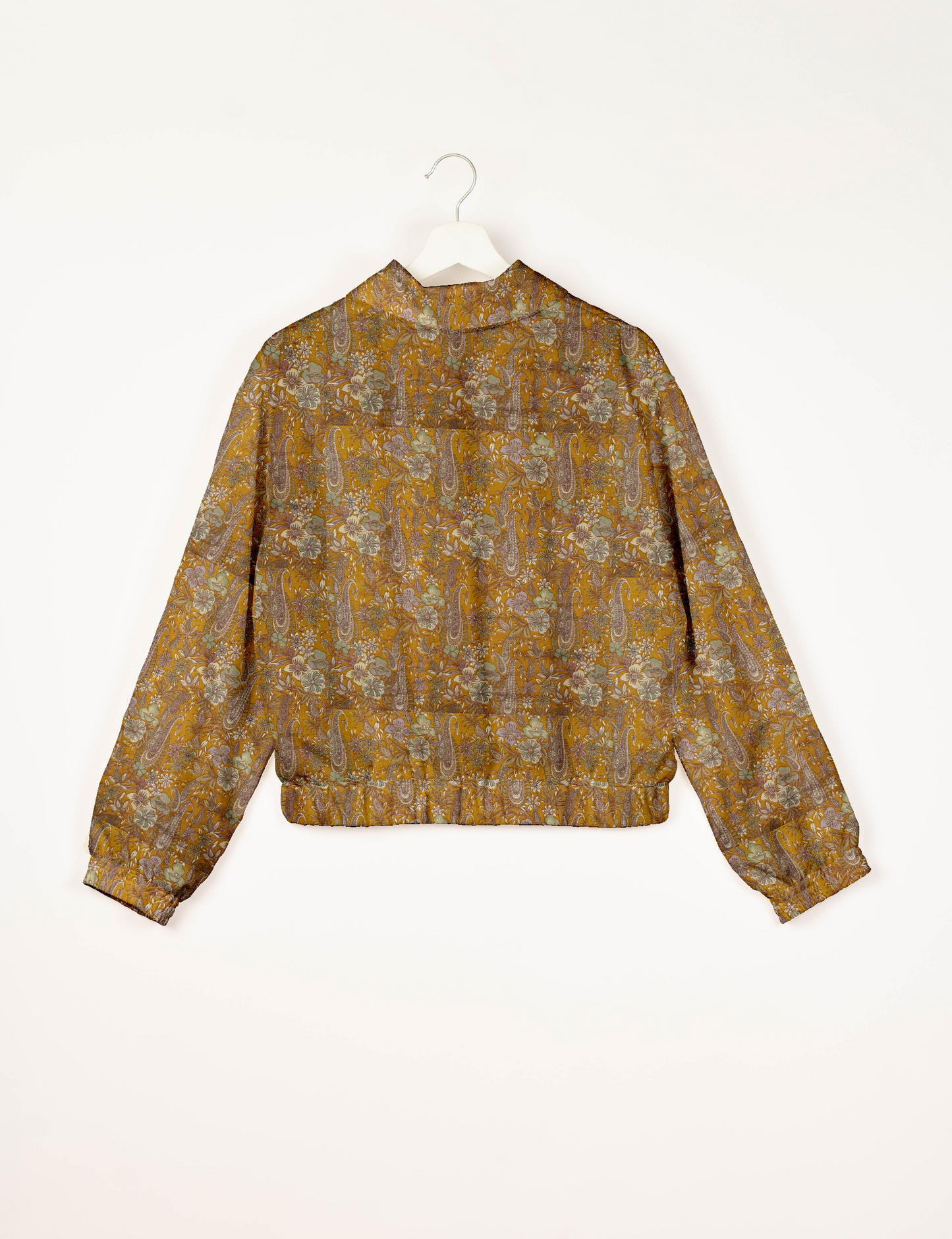 Upcycled Bomber Jacket made from recycled sari materials, featuring a cute cropped shape, elasticated hem and cuffs, and contrast sari print lining. Sustainable apparel promoting eco-friendly fashion and ethical clothing.