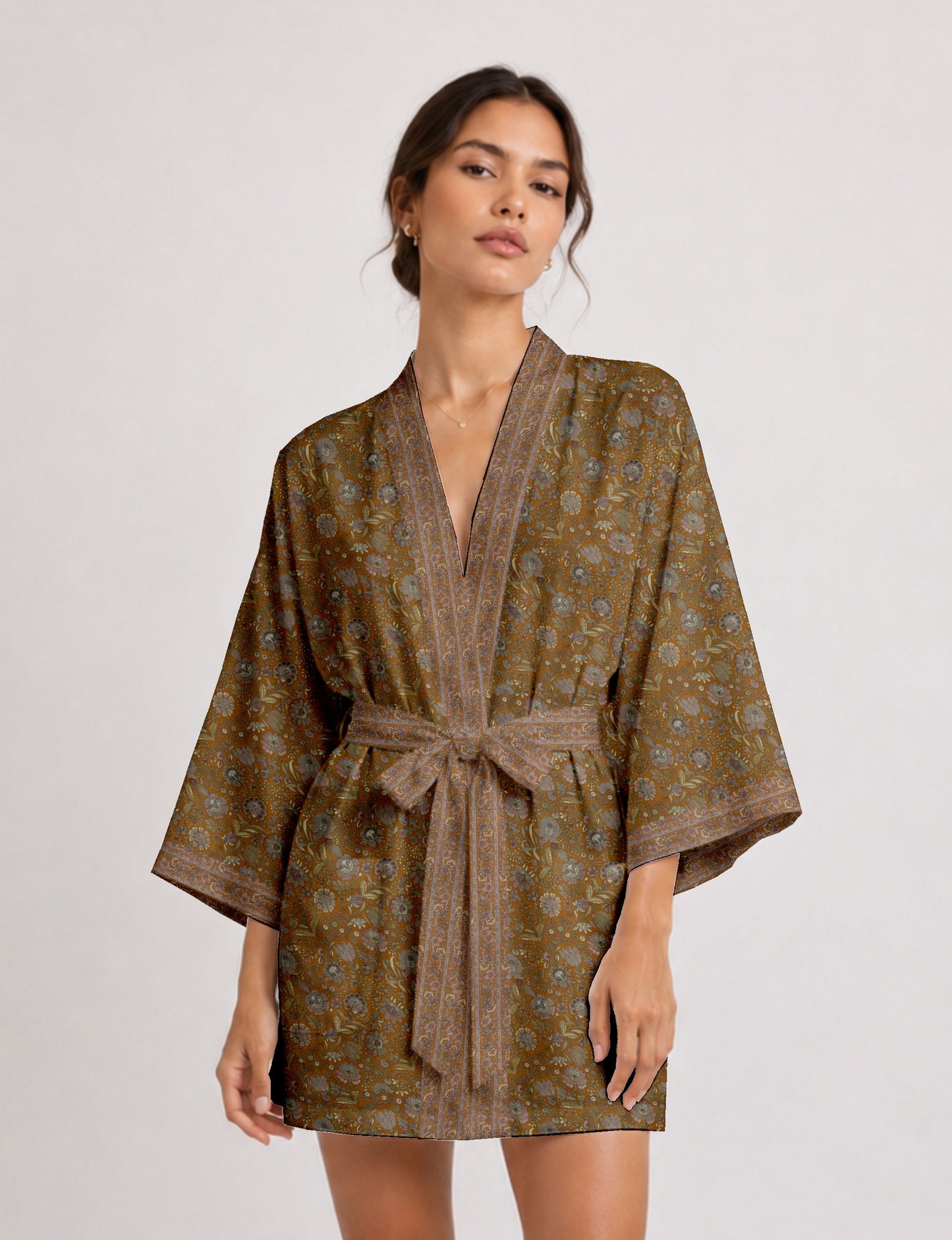 Short kimono robe with wrap front, V-neckline, wide sleeves, waist tie, and concealed skort detail.