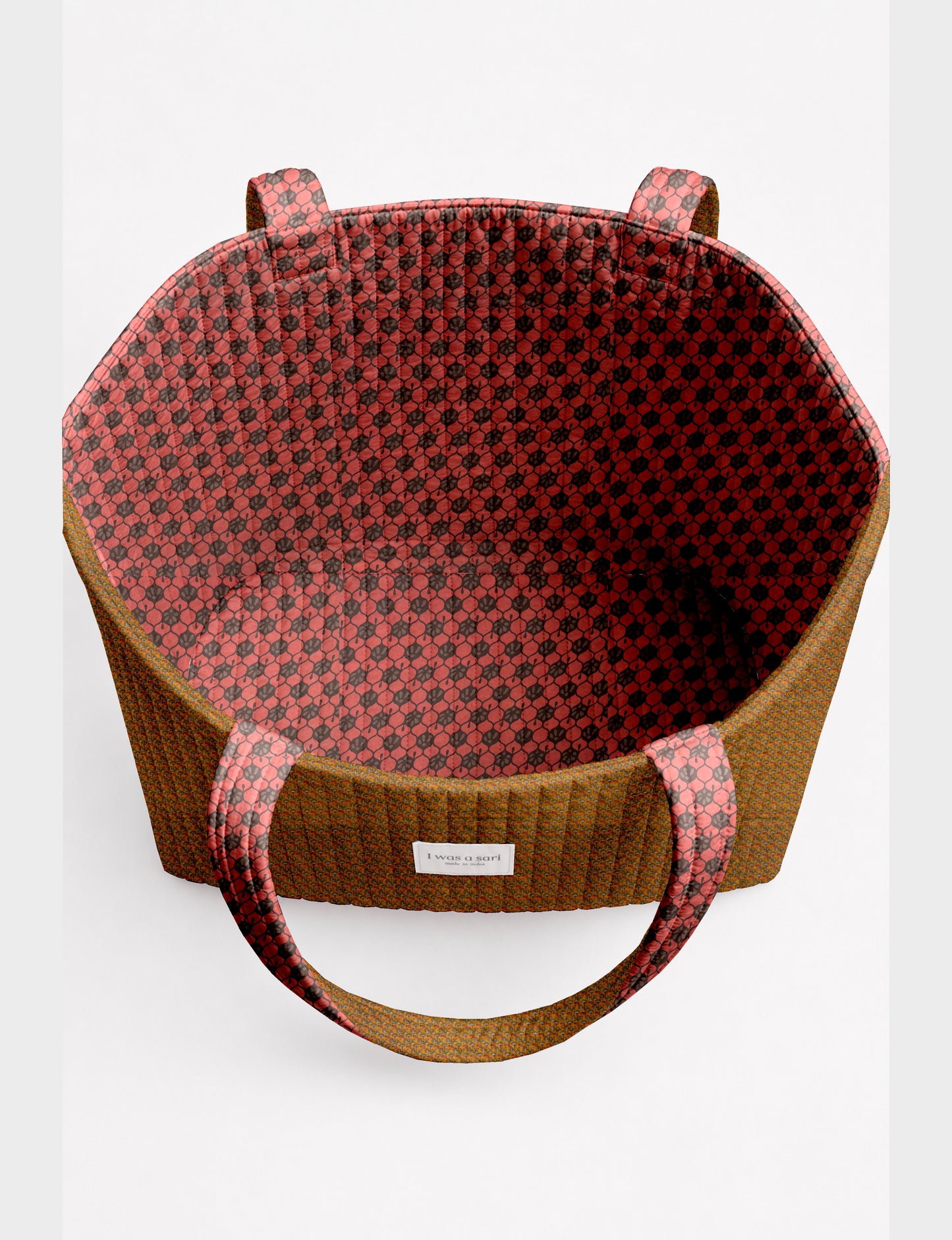 Large quilted beach bag with spacious rectangular design, reinforced shoulder straps, and open-top construction for everyday use and travel.