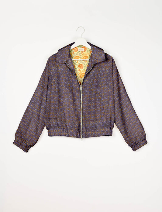Upcycled Bomber Jacket made from recycled sari materials, featuring a cute cropped shape, elasticated hem and cuffs, and contrast sari print lining. Sustainable apparel promoting eco-friendly fashion and ethical clothing.