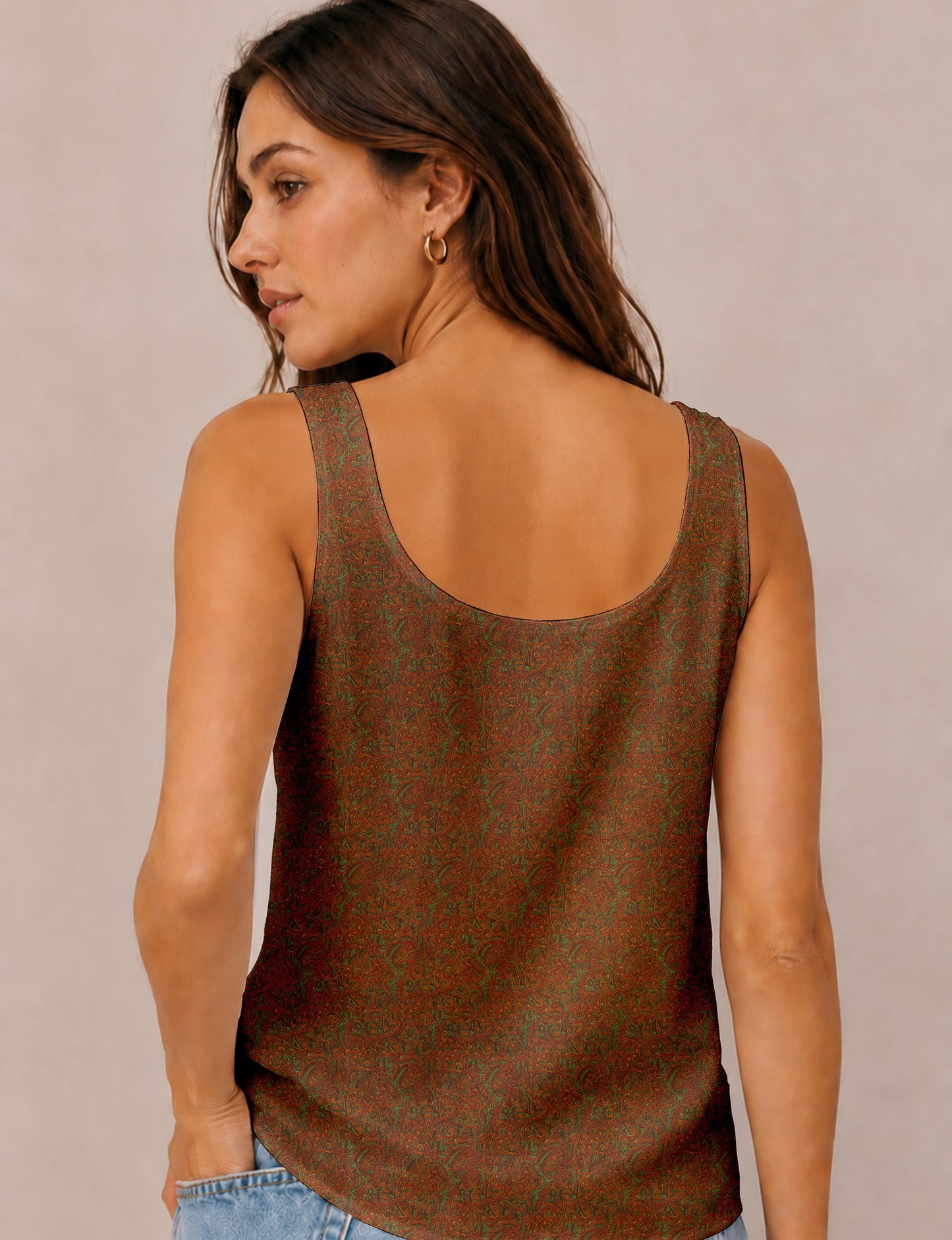 Women's sleeveless blouse with a relaxed straight fit, wide scoop neckline, deep scoop back, and hip-length silhouette.
