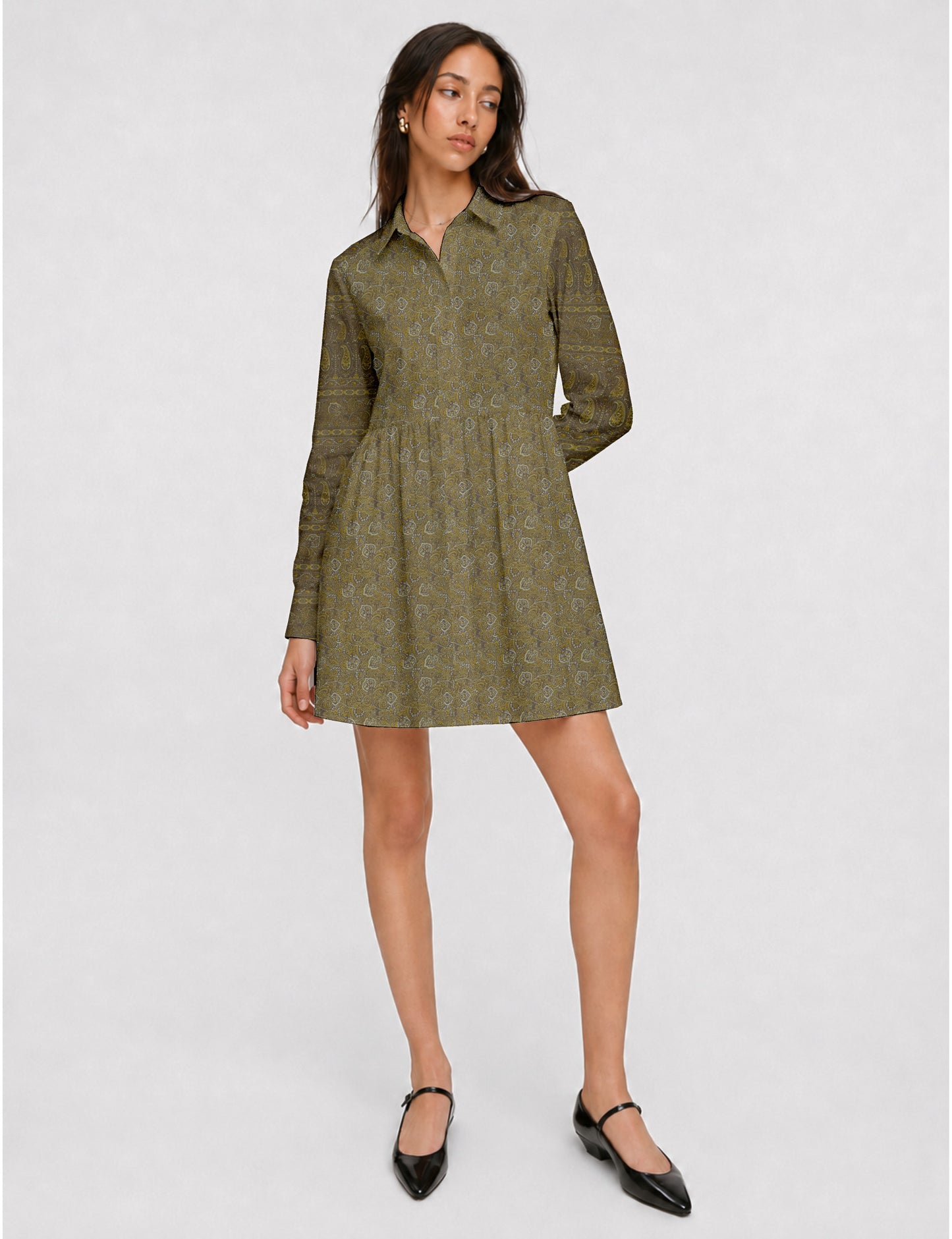 Short shirt dress with a relaxed A-line silhouette, point collar, partial button placket, gathered waist, side pockets, and full-length cuffed sleeves.
